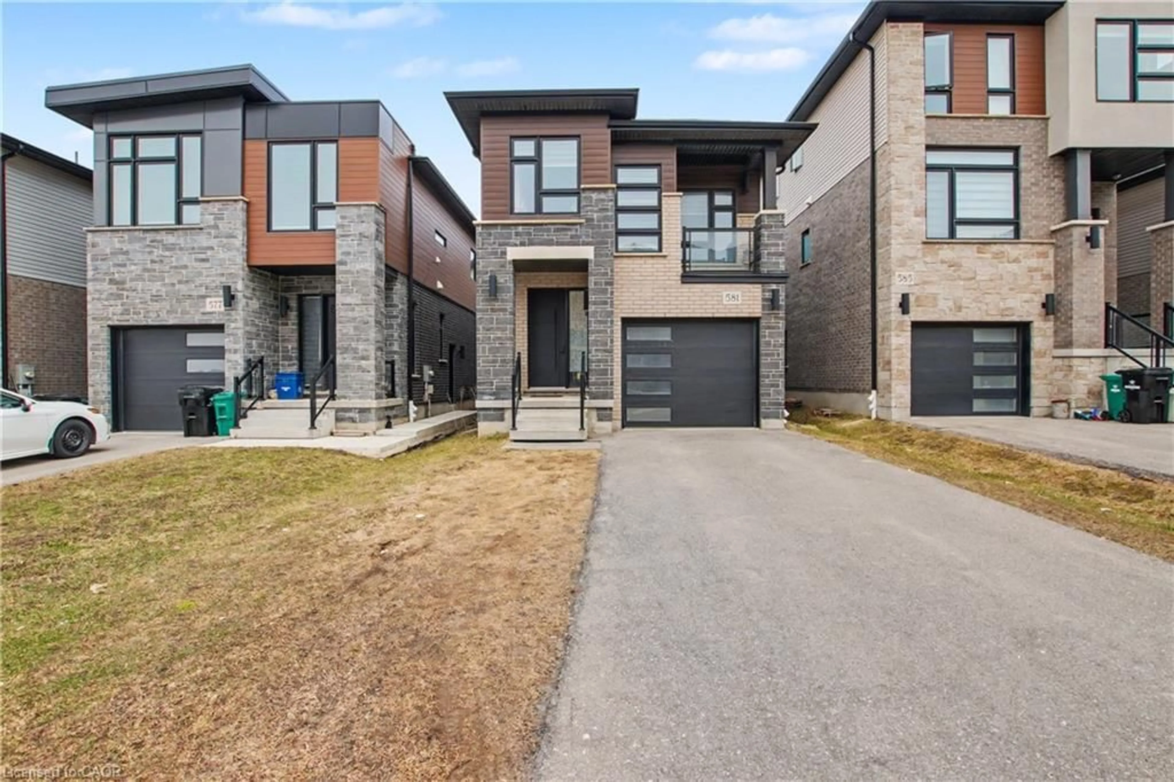 Home with brick exterior material, street for 581 Benninger Dr, Kitchener Ontario N2E 0H8