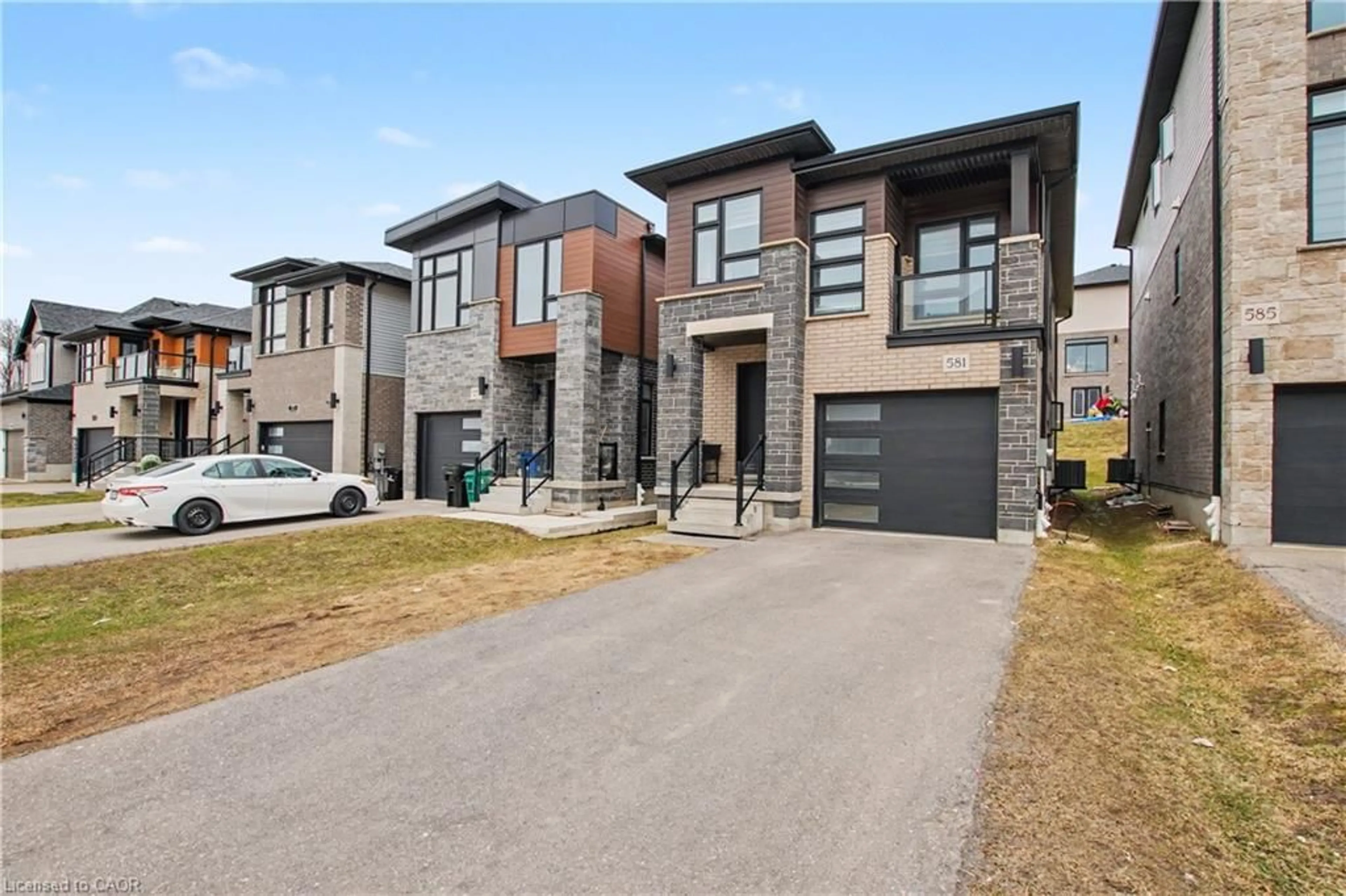 Home with brick exterior material, street for 581 Benninger Dr, Kitchener Ontario N2E 0H8