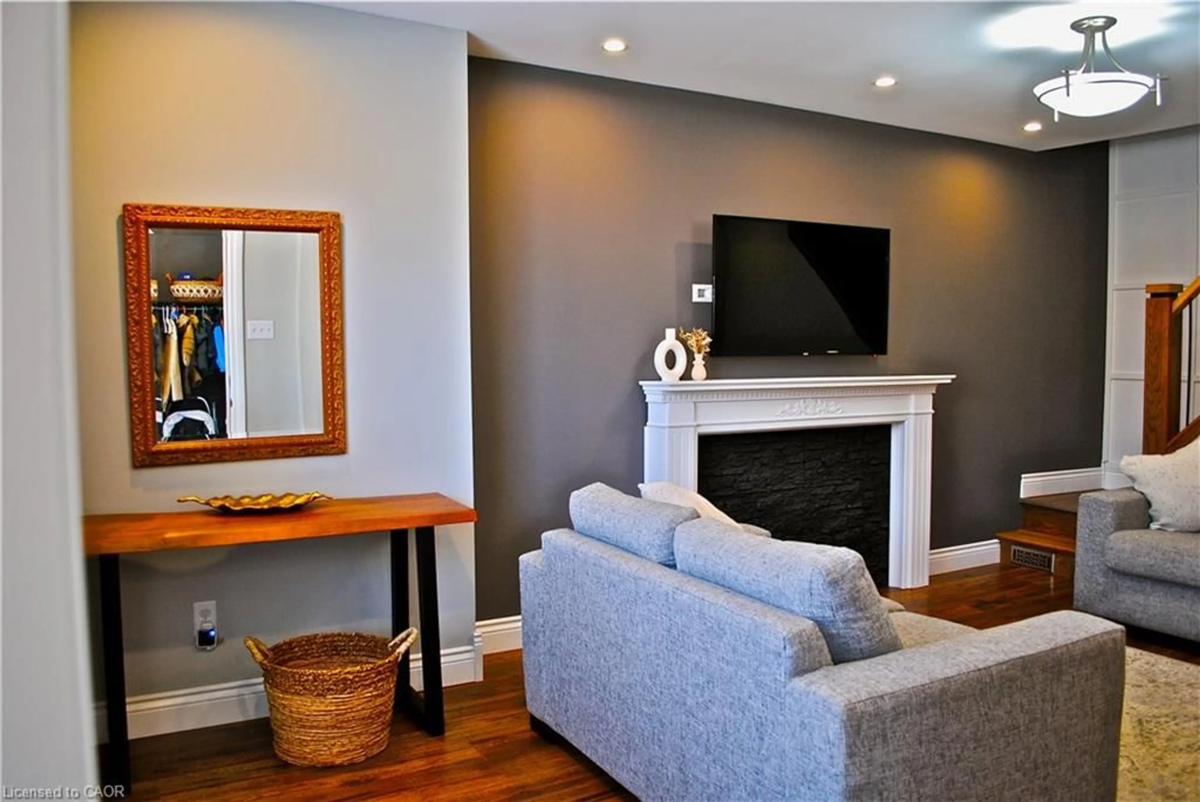 Living room with furniture, wood/laminate floor for 107 Graham Ave, Hamilton Ontario L8K 2M2