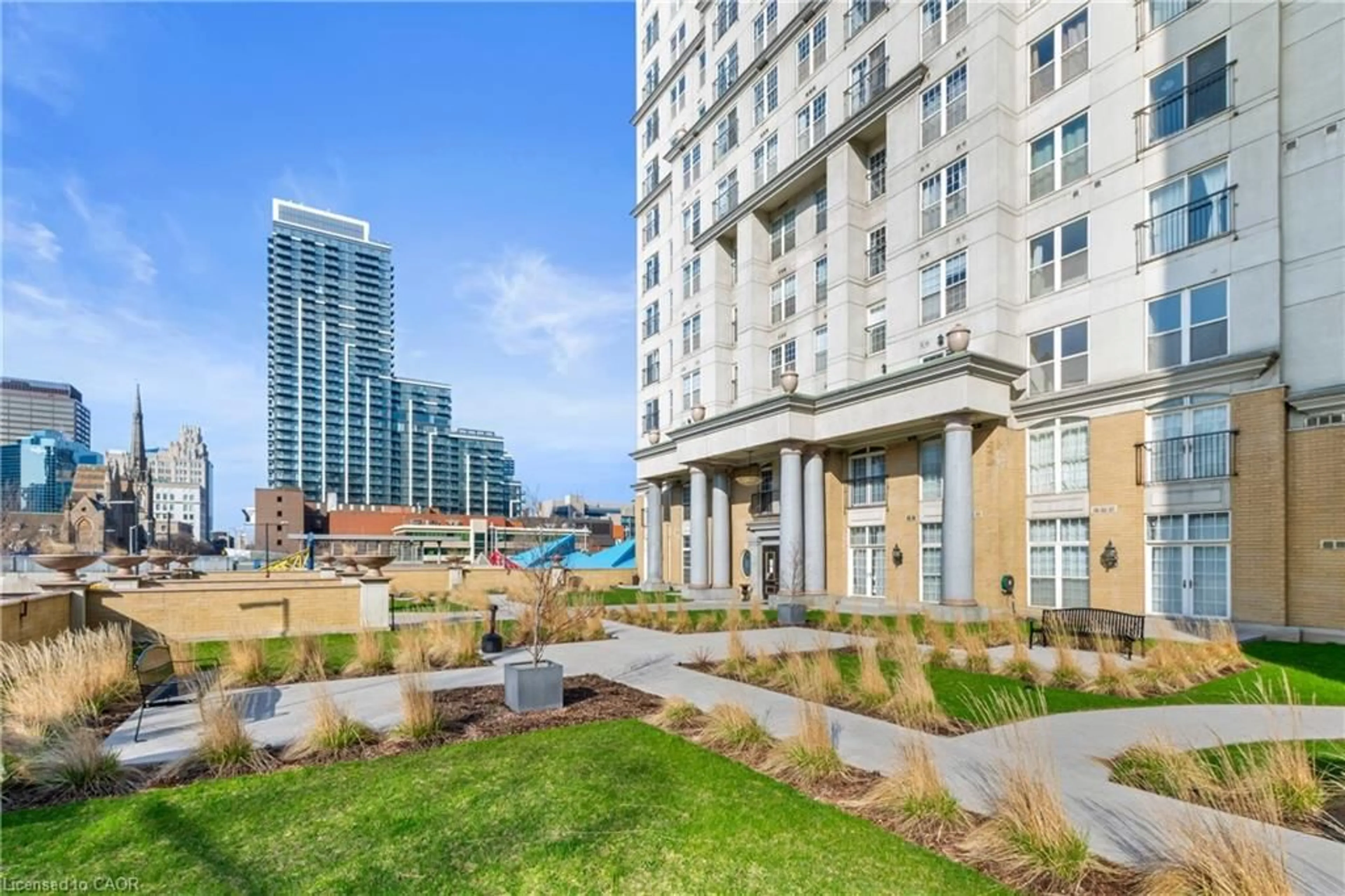 Patio, city buildings view from balcony for 135 James St #303, Hamilton Ontario L8P 2Z6