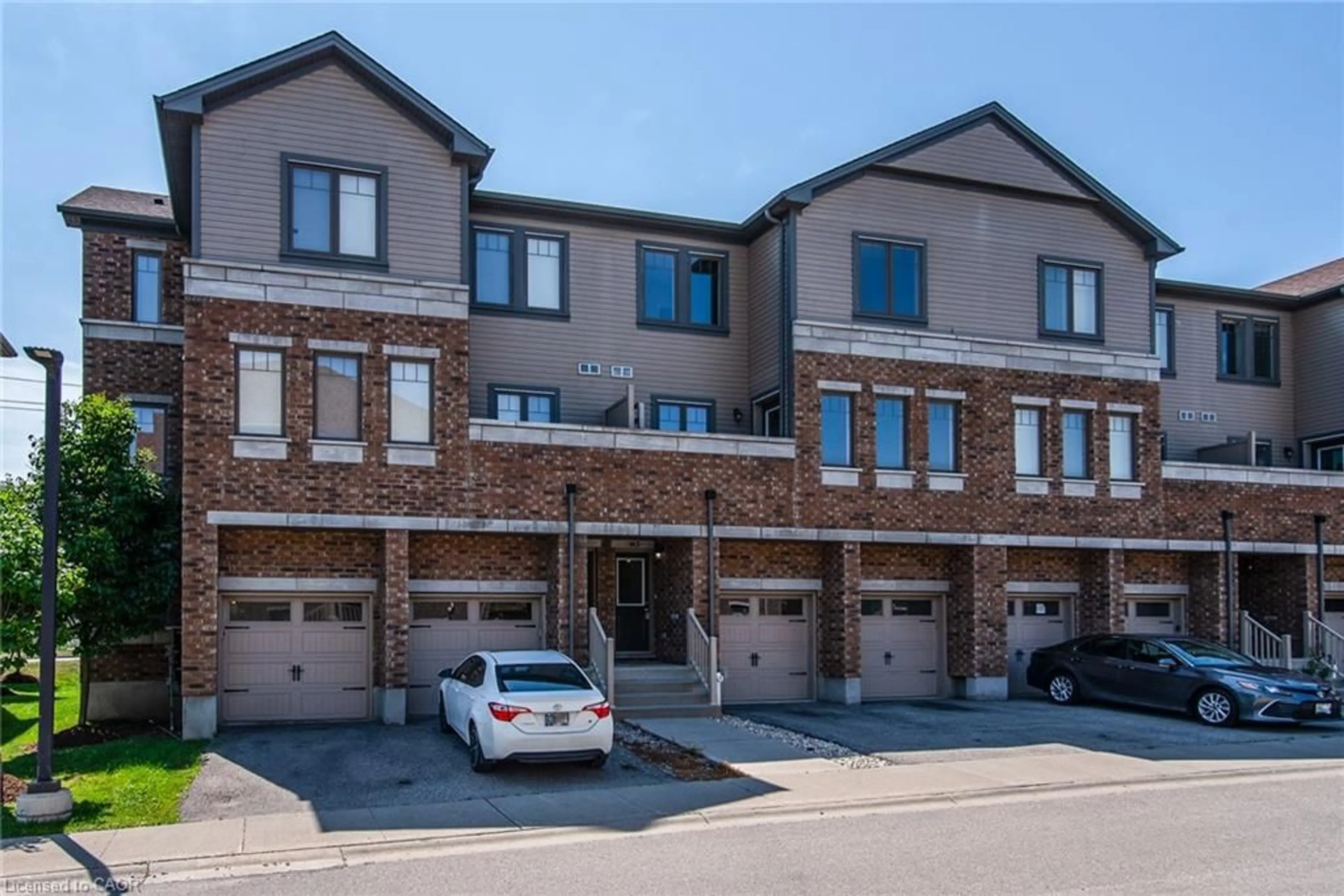 Home with brick exterior material, street for 70 Willowrun Dr #H3, Kitchener Ontario N2A 0J3
