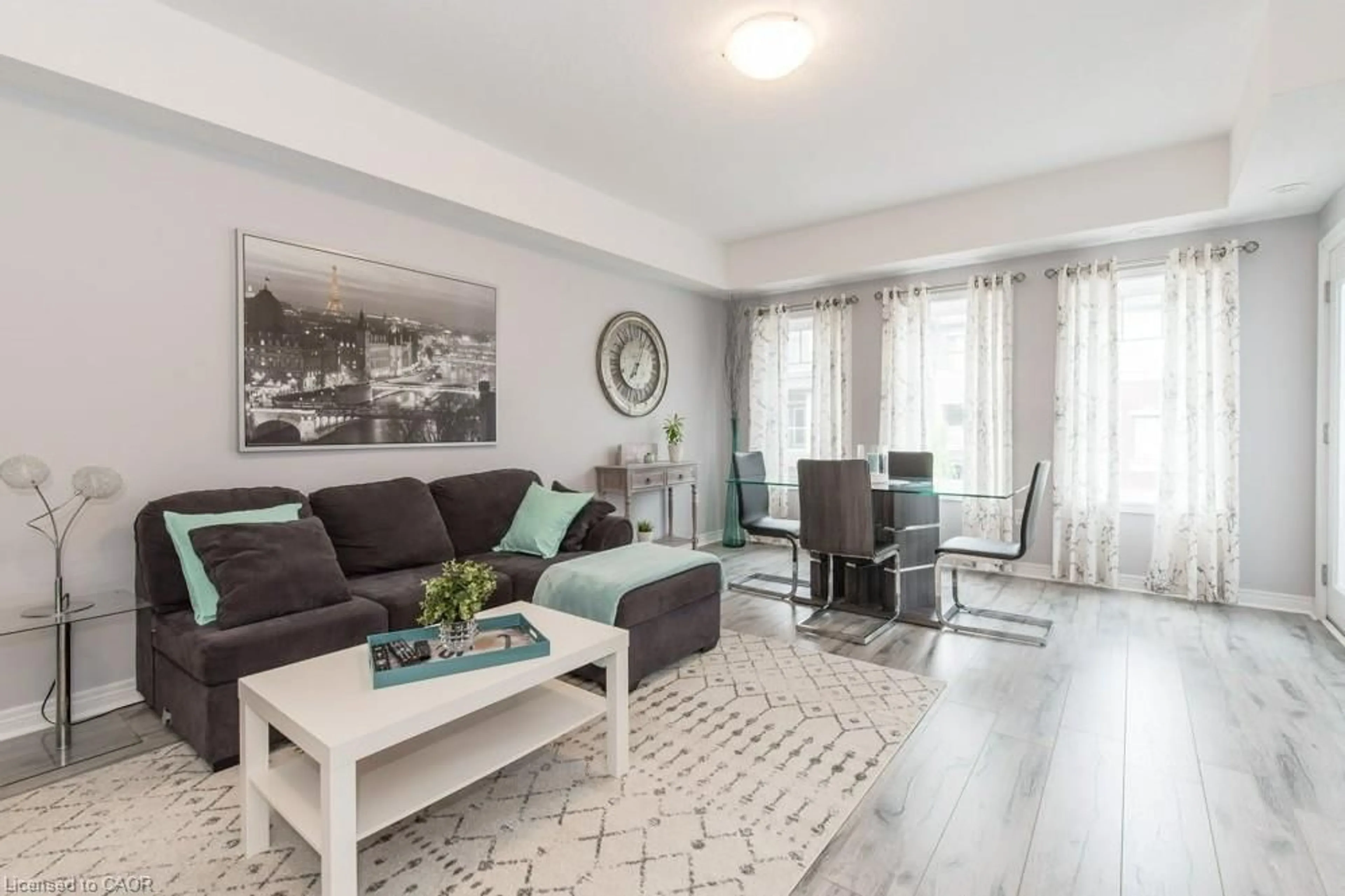 Living room with furniture, wood/laminate floor for 70 Willowrun Dr #H3, Kitchener Ontario N2A 0J3