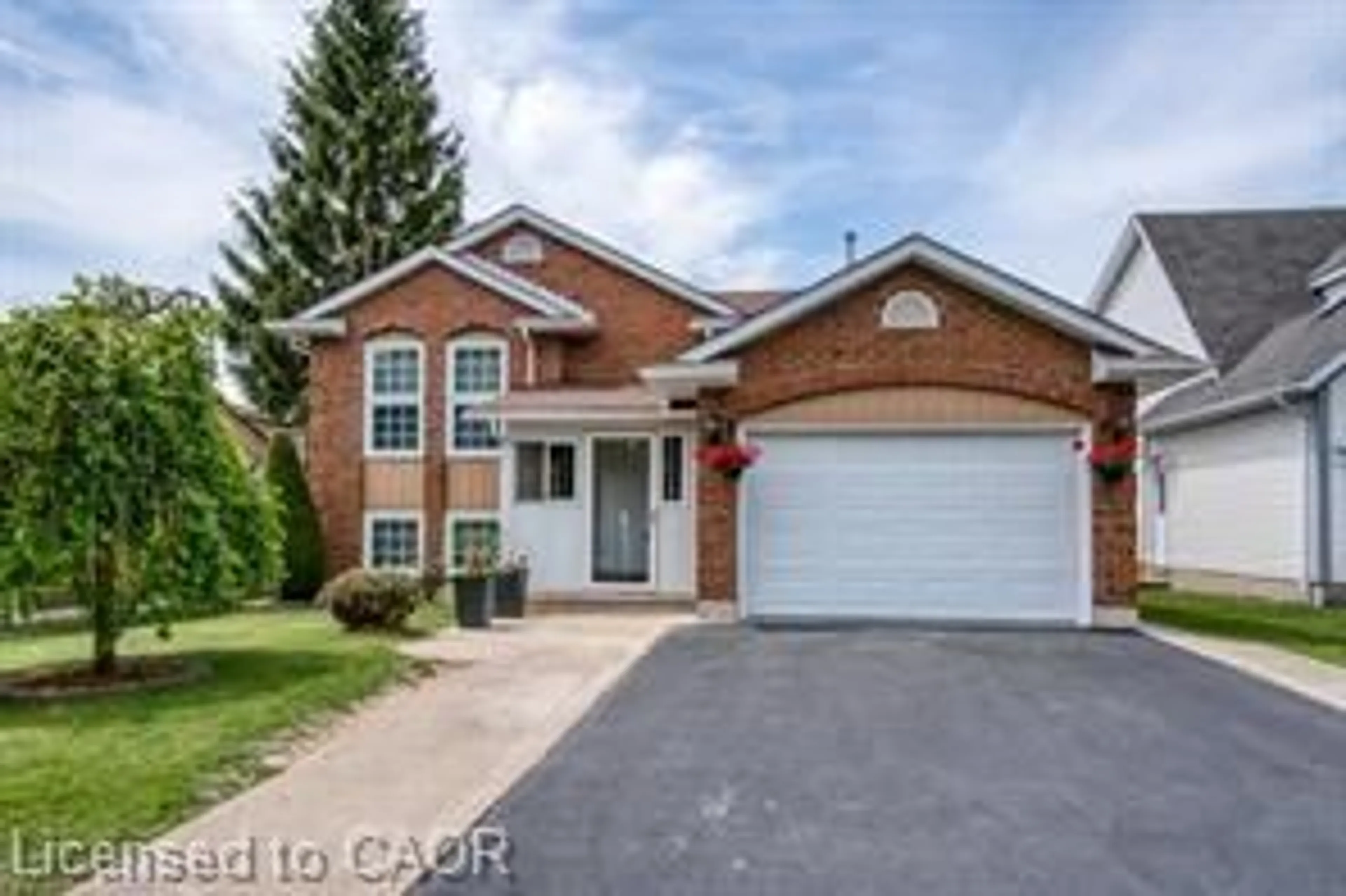 Home with brick exterior material, street for 23 Westchester Dr, Kitchener Ontario N2B 3T1
