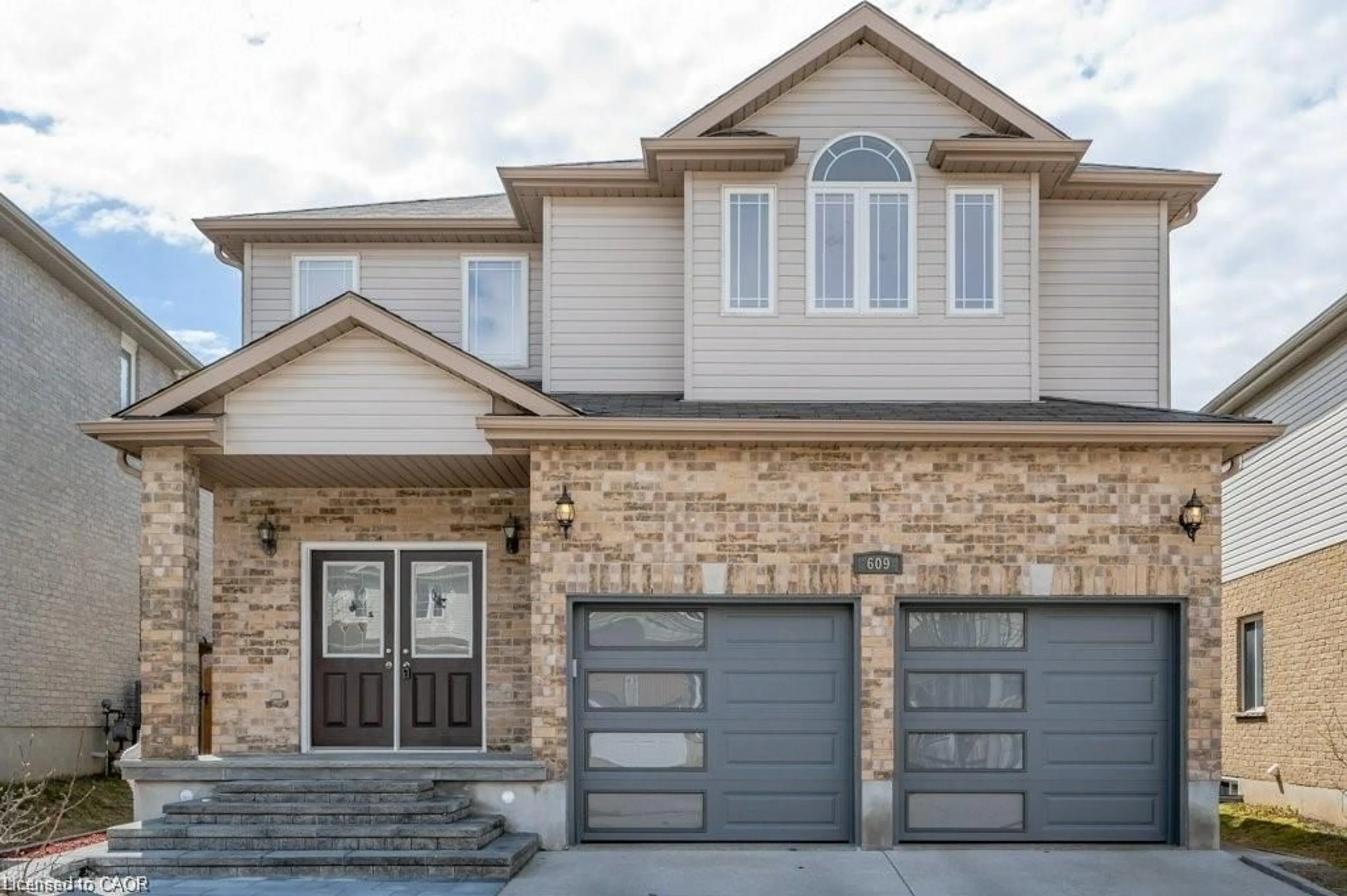 Home with brick exterior material, street for 609 Woolgrass Ave, Waterloo Ontario N2V 2X9