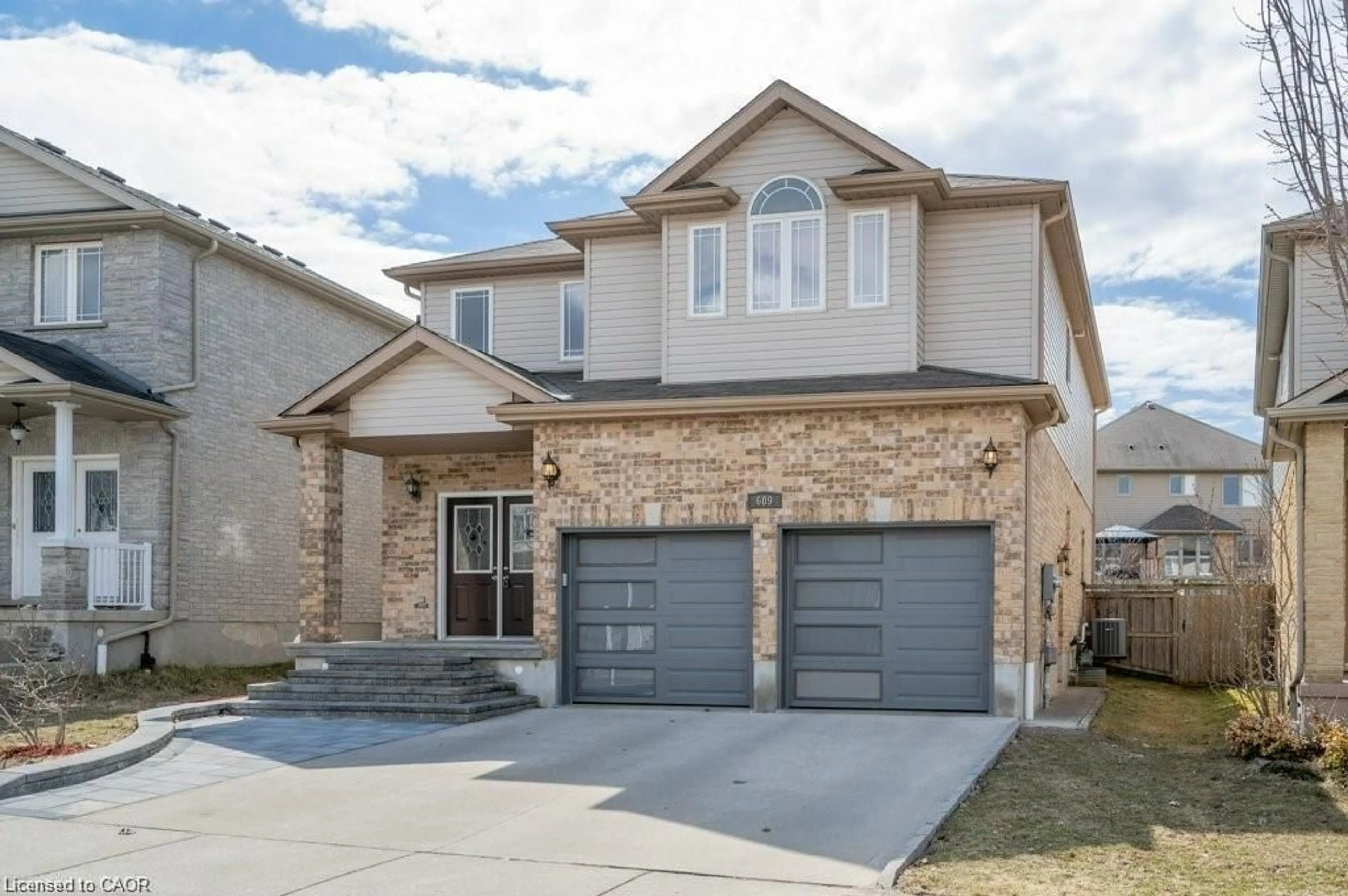 Home with brick exterior material, street for 609 Woolgrass Ave, Waterloo Ontario N2V 2X9