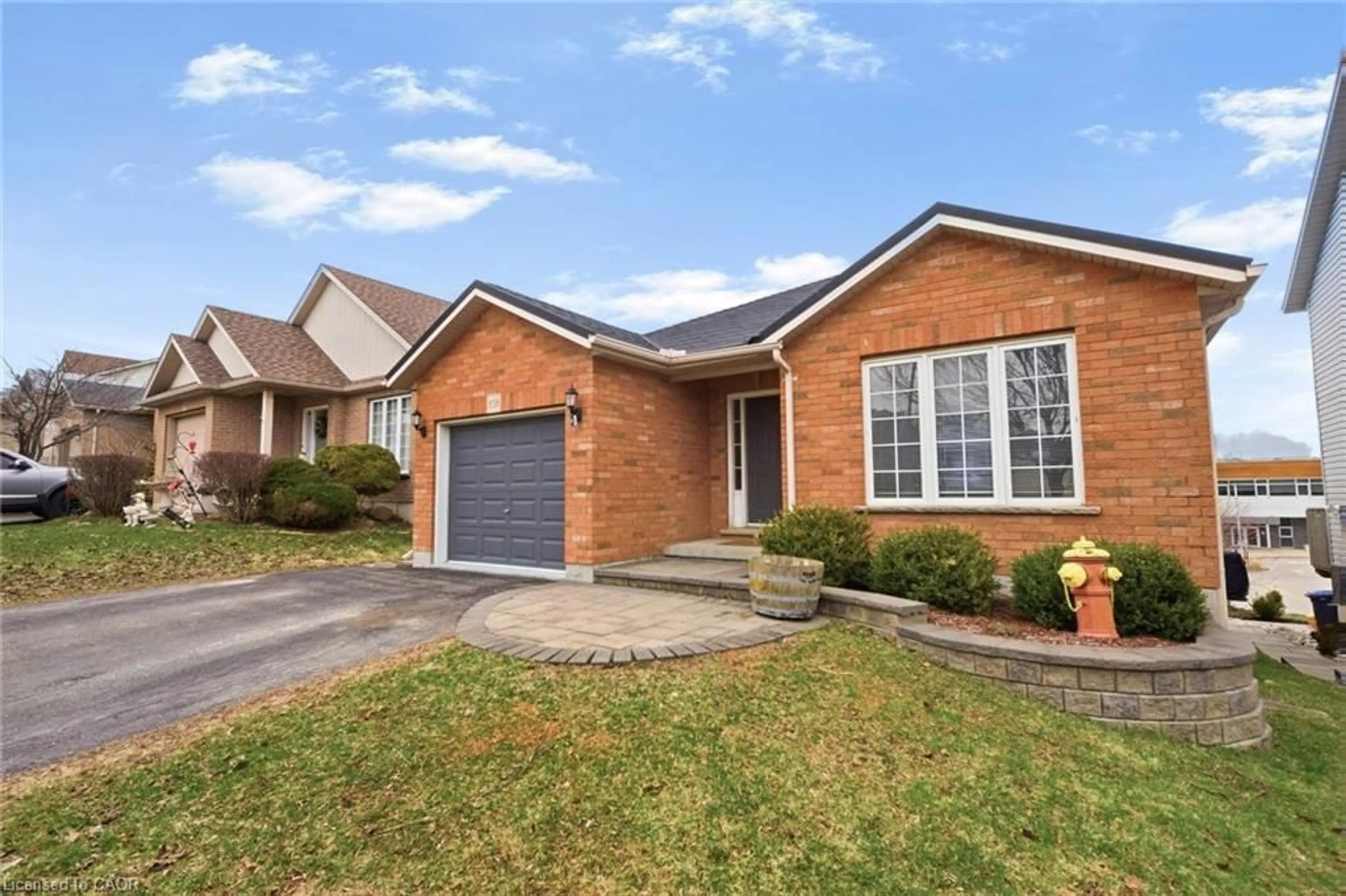 Home with brick exterior material, street for 858 Stonegate Dr, Woodstock Ontario N4V 1G4