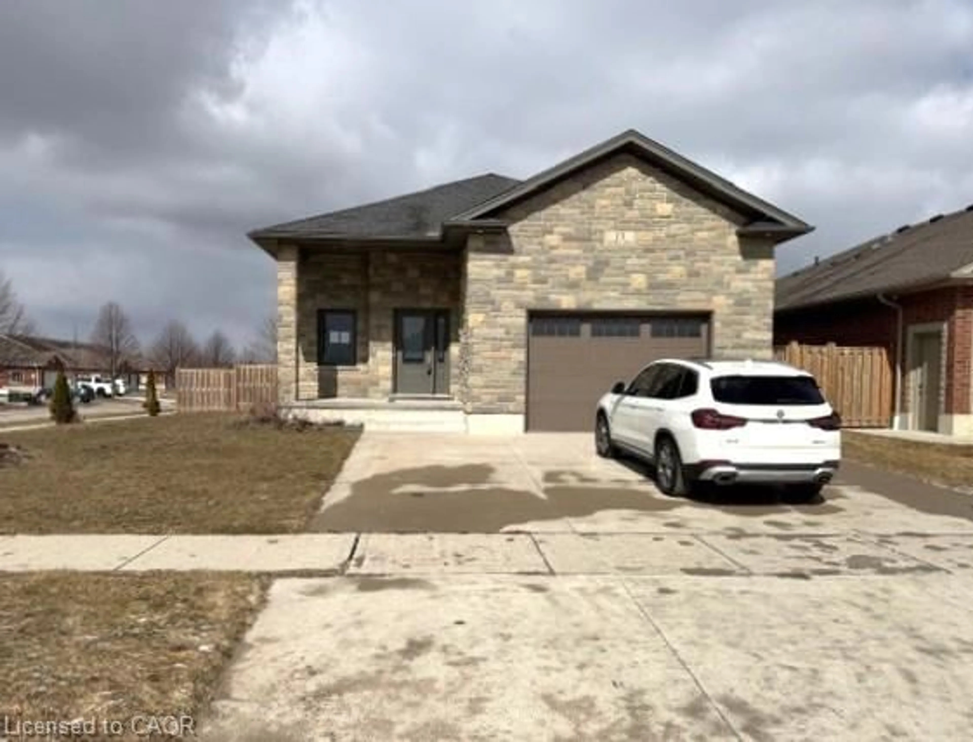 Home with brick exterior material, street for 13 Forbes Cres, Listowel Ontario N4W 0B3