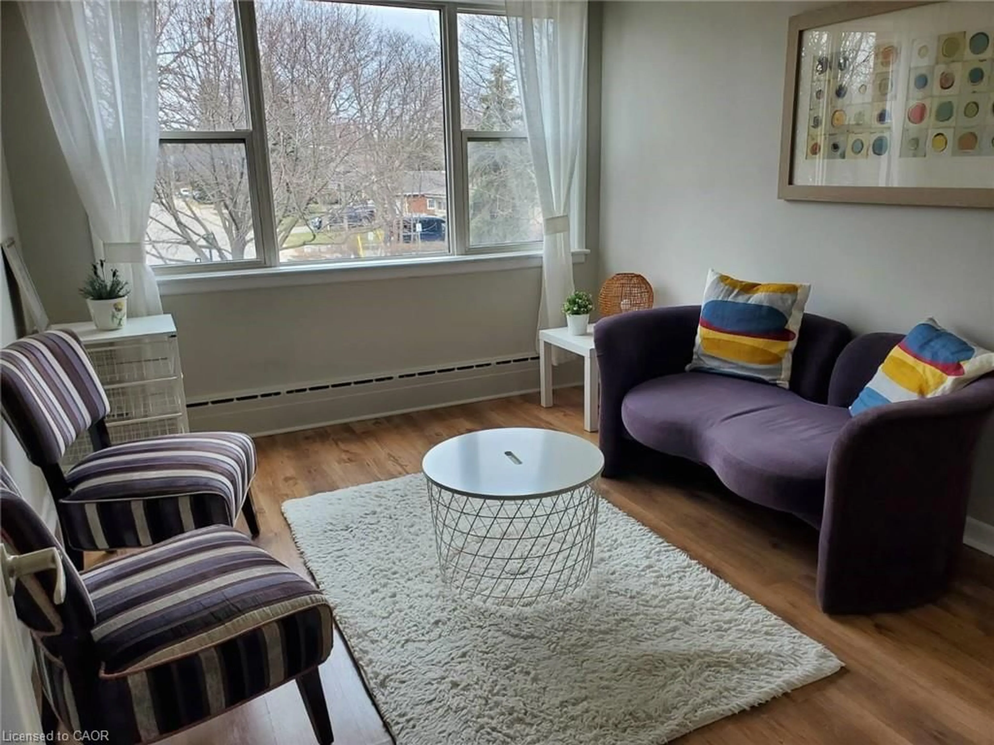 Living room with furniture, unknown for 2052 Courtland Dr #303, Burlington Ontario L7R 1R8