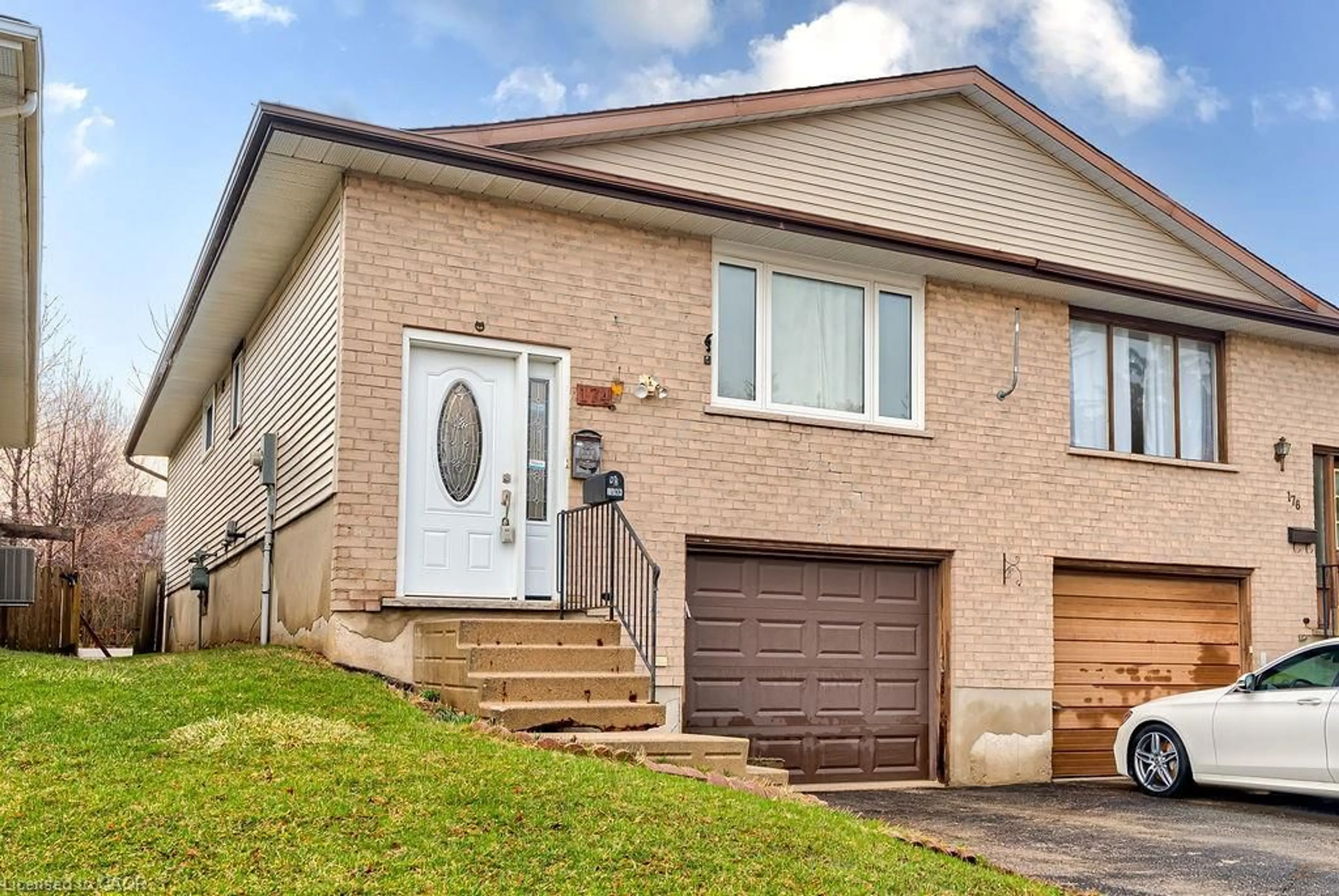 Home with brick exterior material, street for 174 Thaler Ave, Kitchener Ontario N2A 1R5