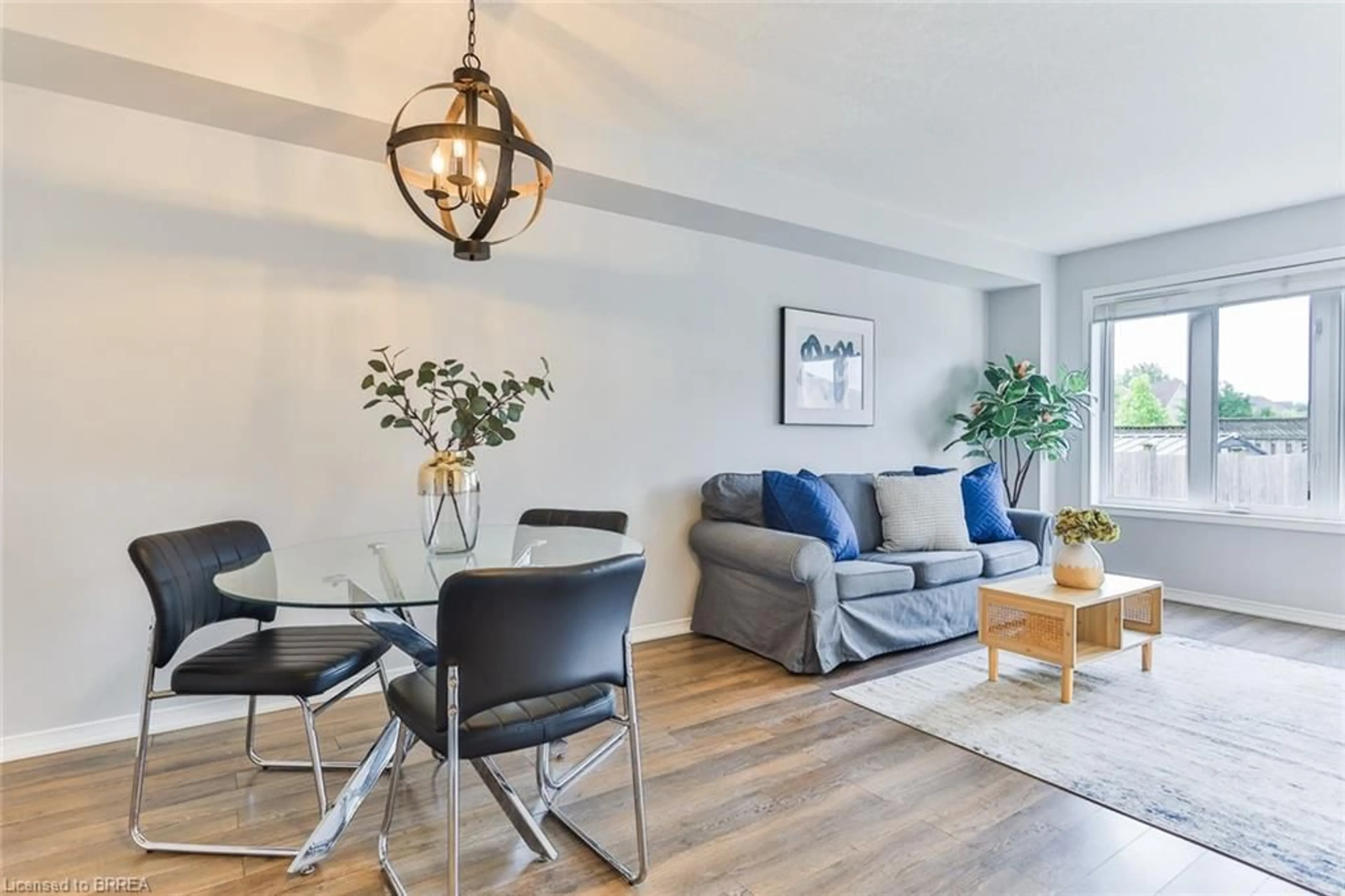 Living room with furniture, wood/laminate floor for 3 Dwyer Crt, Brantford Ontario N3T 0G8