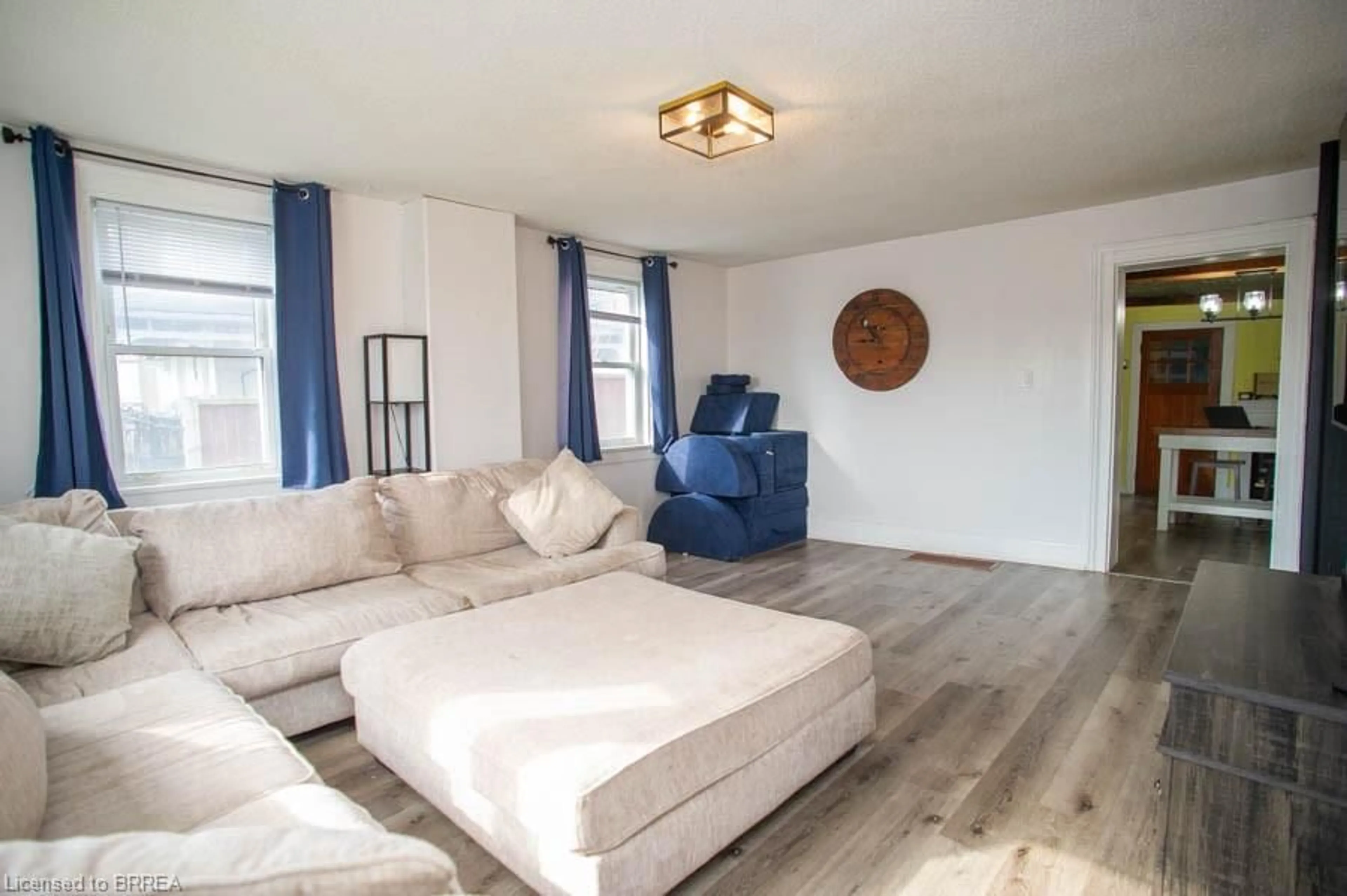 Living room with furniture, wood/laminate floor for 47 Simcoe St, Scotland Ontario N0E 1R0