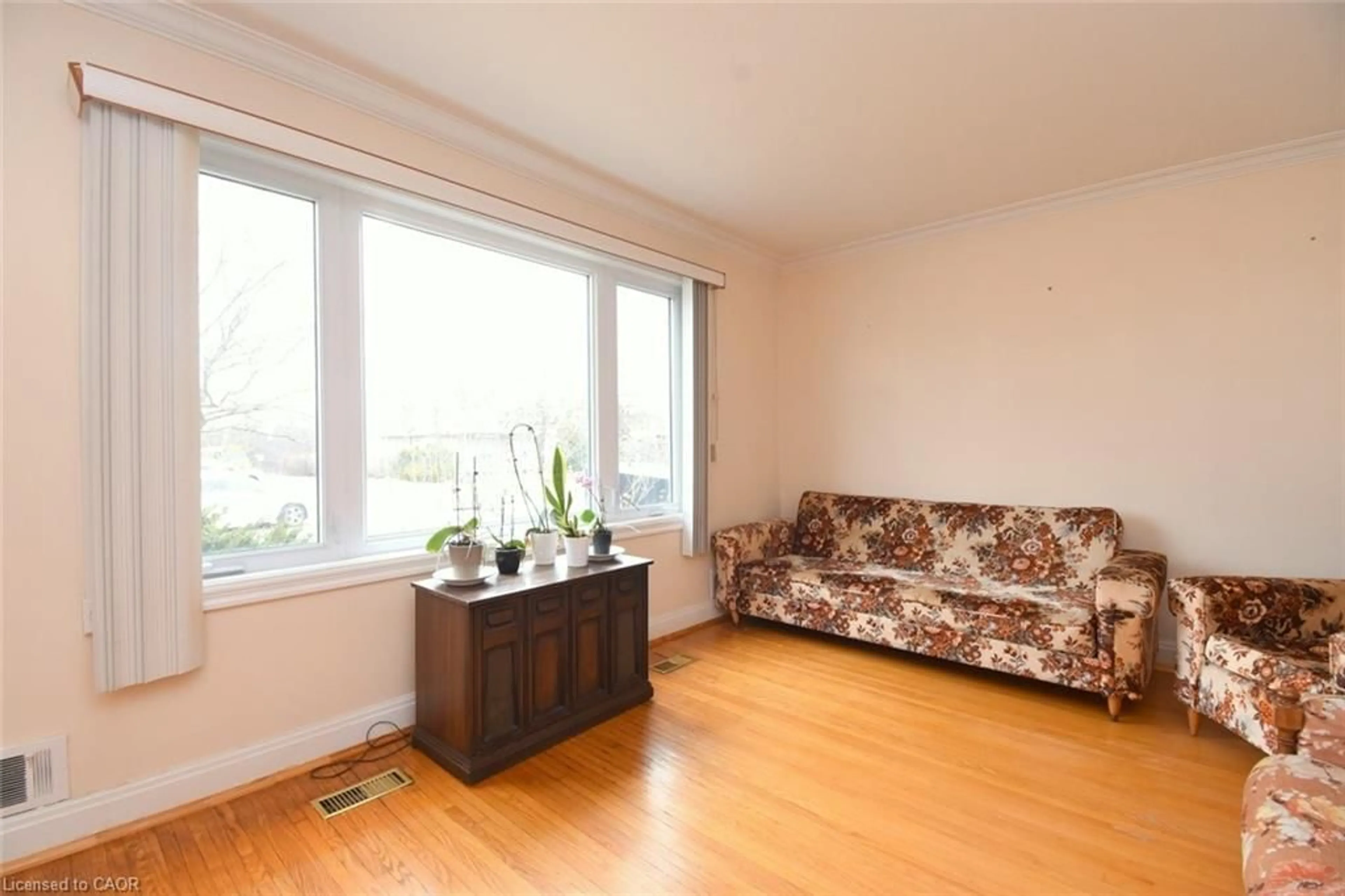 Living room with furniture, wood/laminate floor for 65 Hadrian Dr, Etobicoke Ontario M9W 1V6