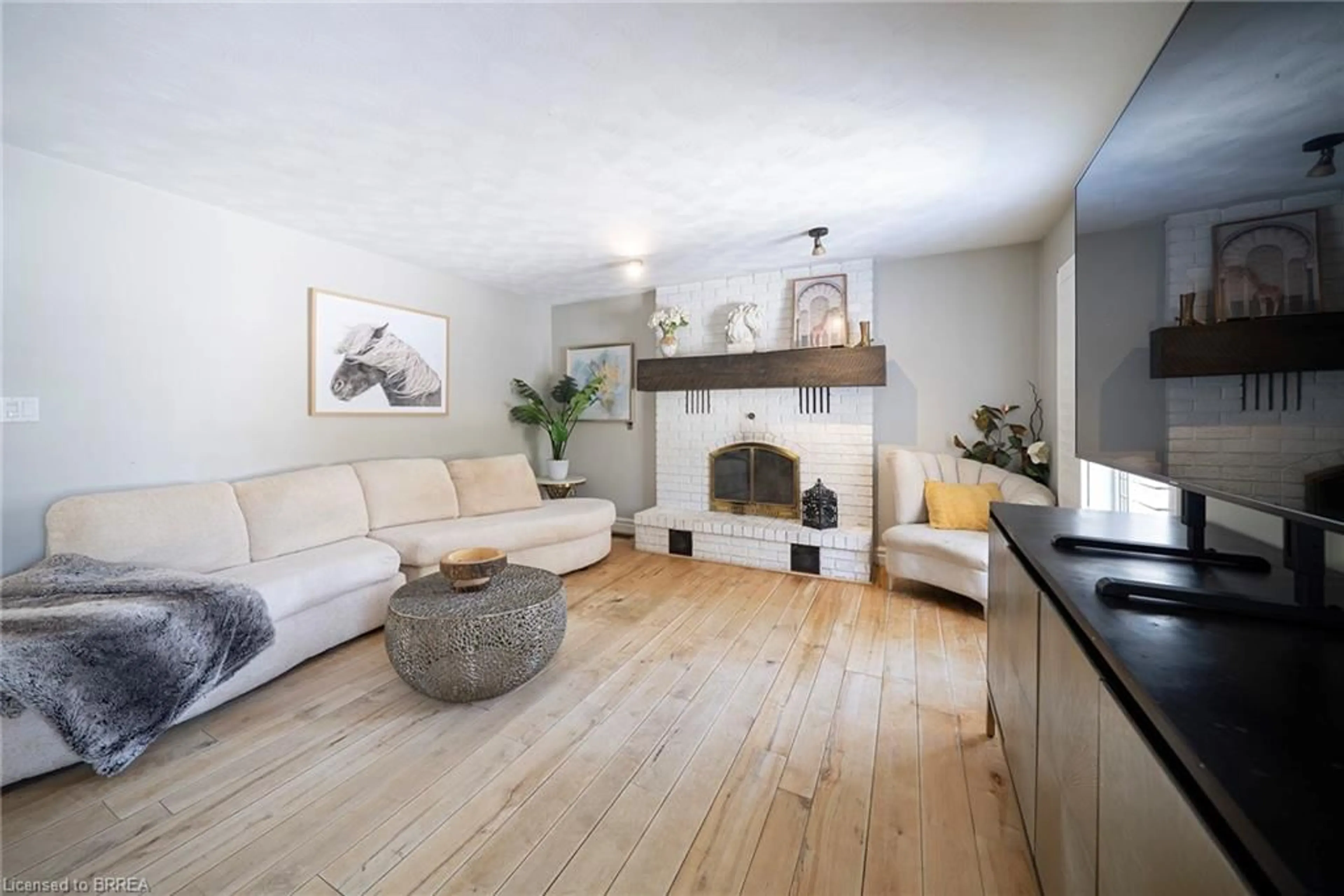 Living room with furniture, wood/laminate floor for 428 Charlotteville Road 1, St. Williams Ontario N0E 1P0