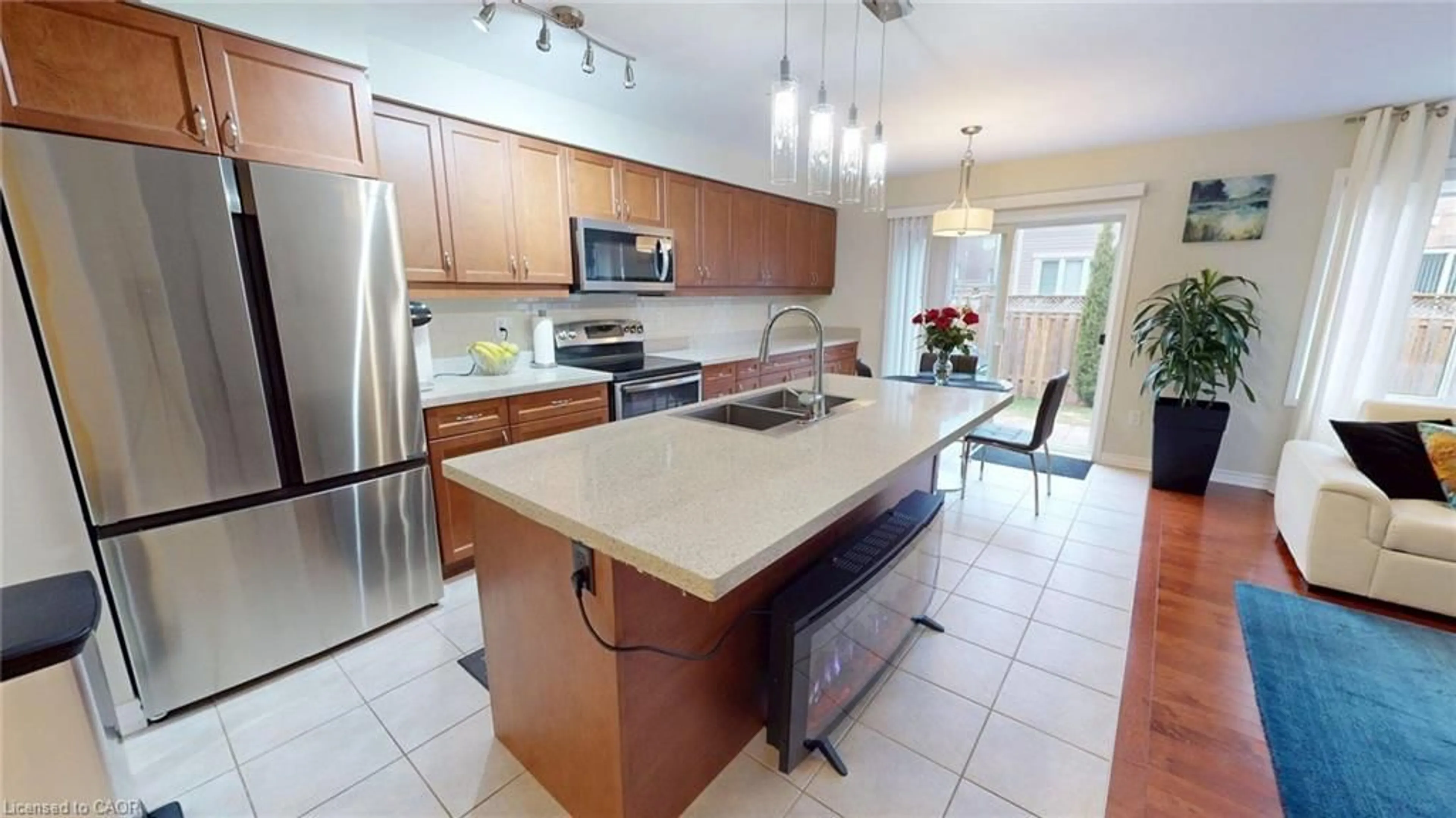 Open concept kitchen, ceramic/tile floor for 293 Reis Pl, Milton Ontario L9E 0A9