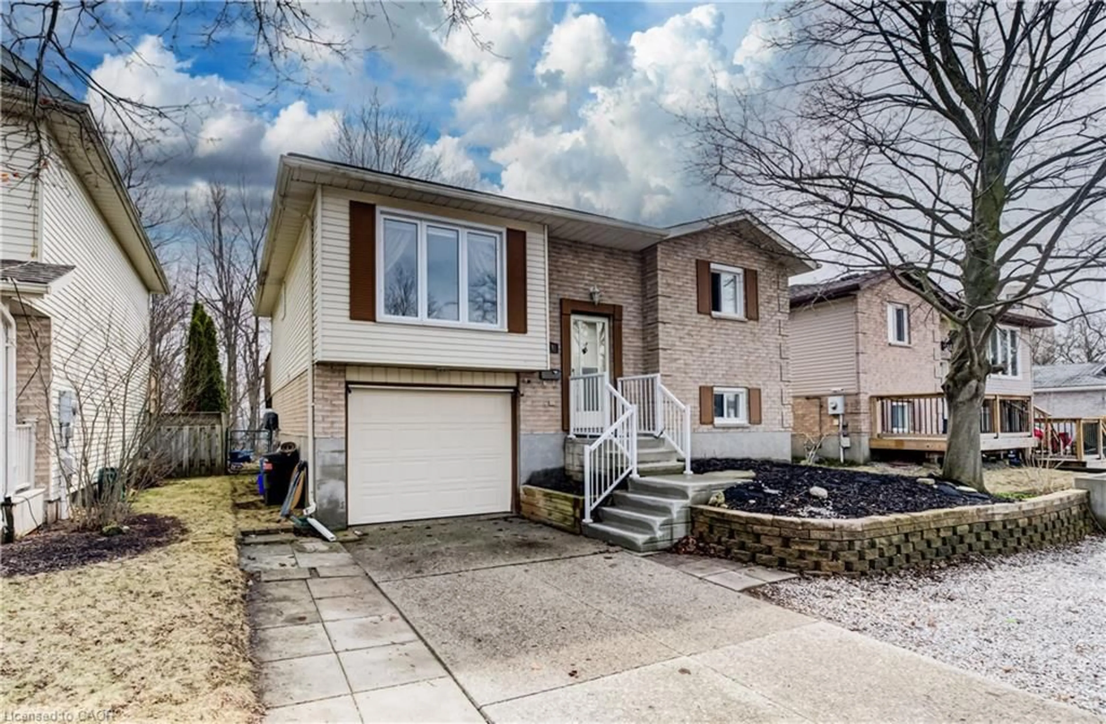 Home with vinyl exterior material, street for 414 Woods Lane, Cambridge Ontario N3H 5J4