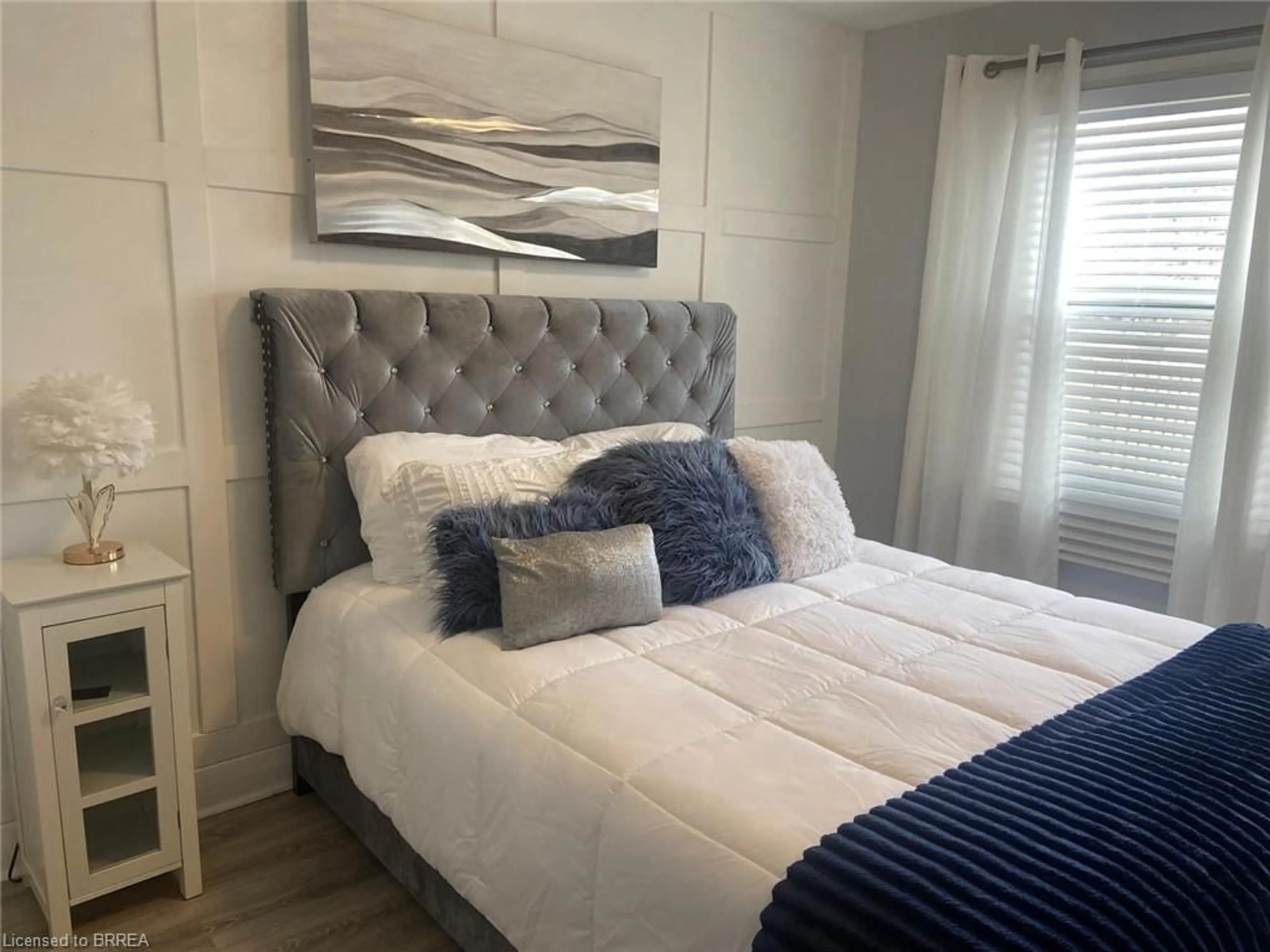 Bedroom with bed, wood/laminate floor for 75 Tollgate Rd, Brantford Ontario N3R 4Z5