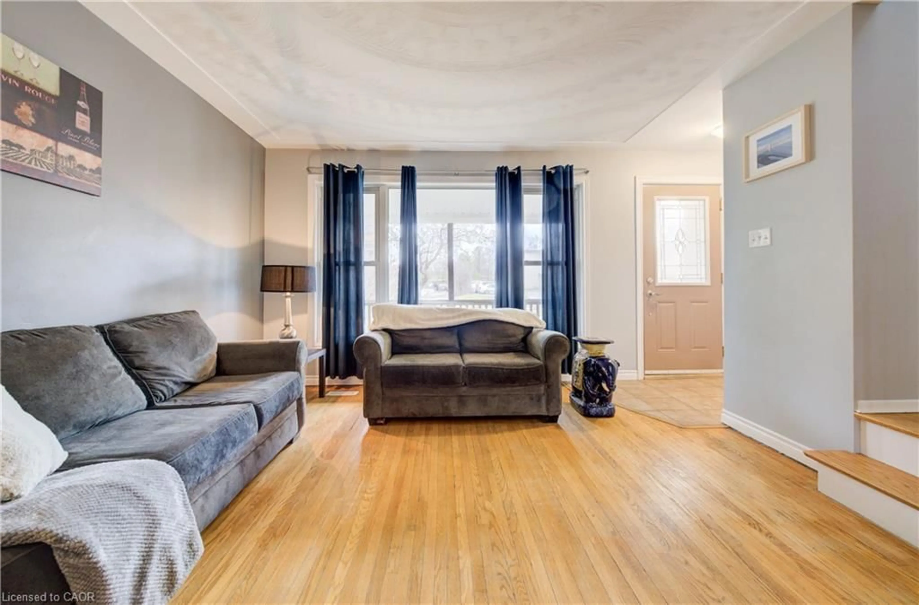 Living room with furniture, wood/laminate floor for 88 Westwood Dr, Kitchener Ontario N2M 2K6