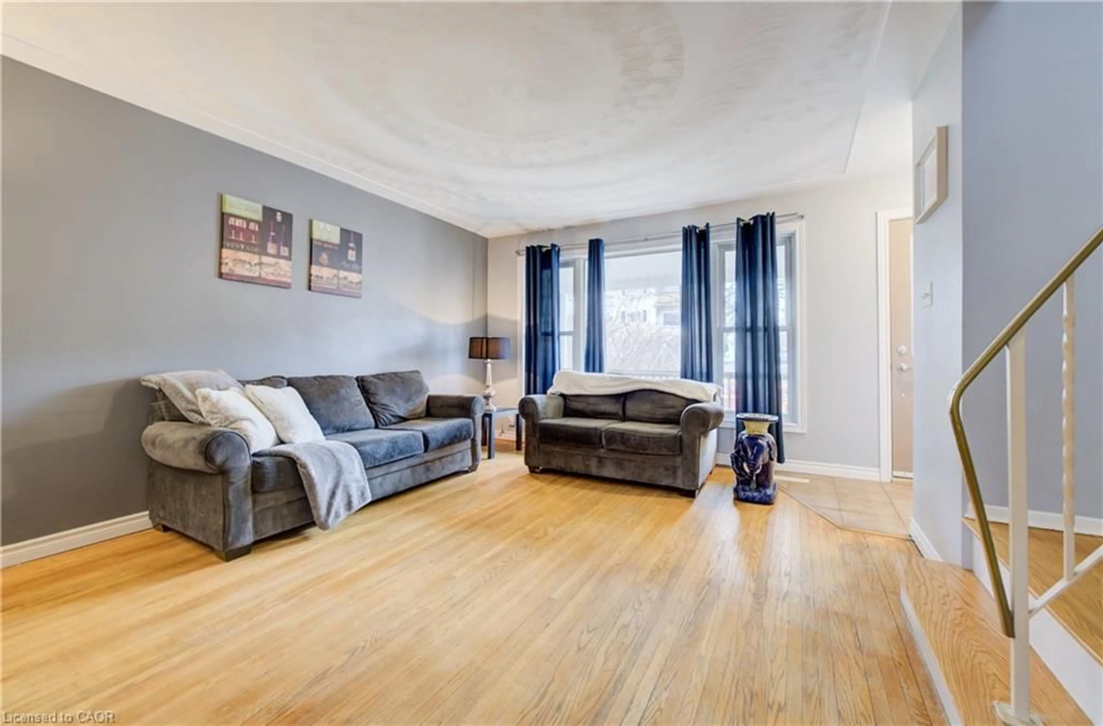 Living room with furniture, wood/laminate floor for 88 Westwood Dr, Kitchener Ontario N2M 2K6