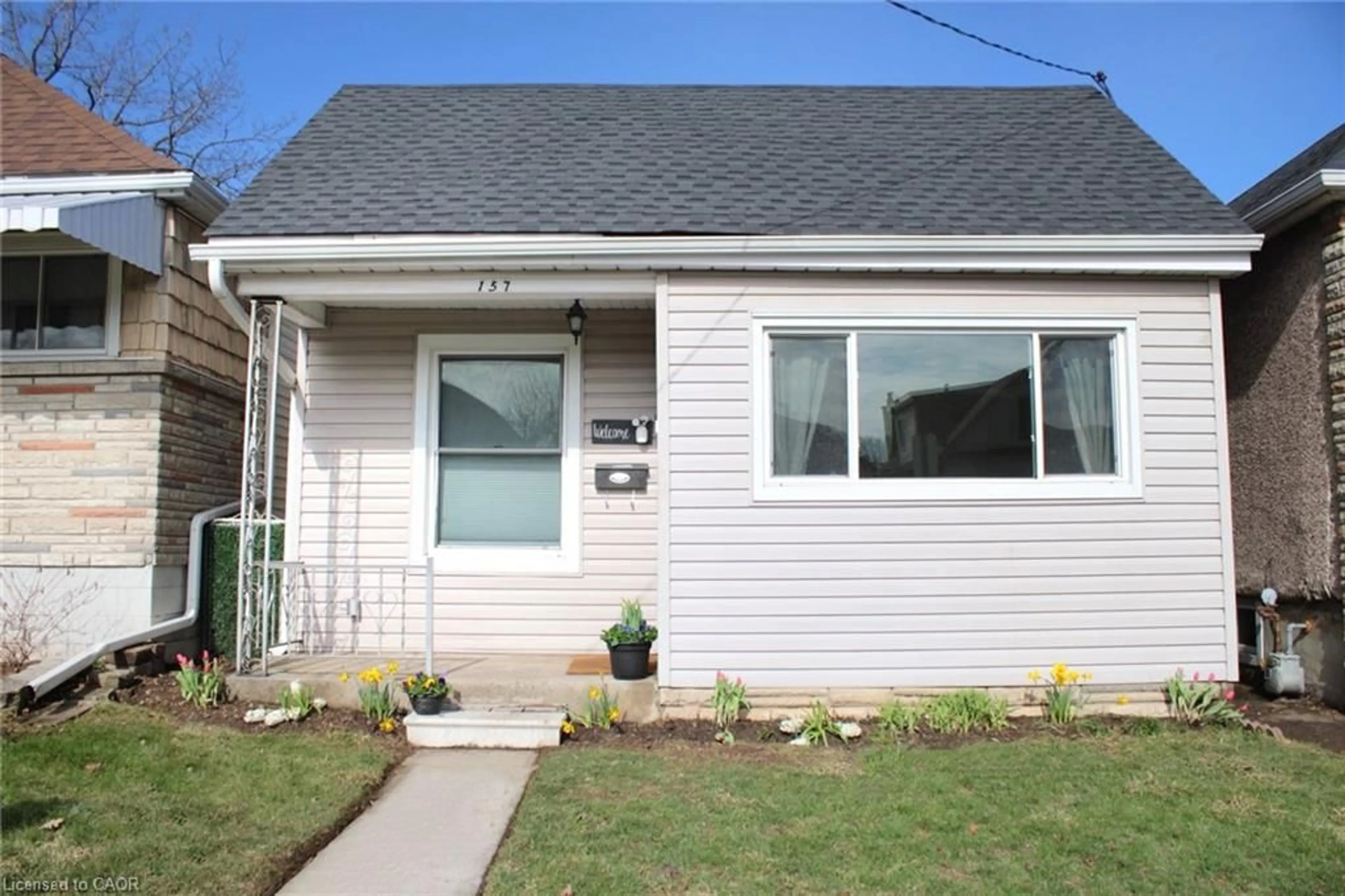Home with vinyl exterior material, street for 157 Tragina Ave, Hamilton Ontario L8H 5C7