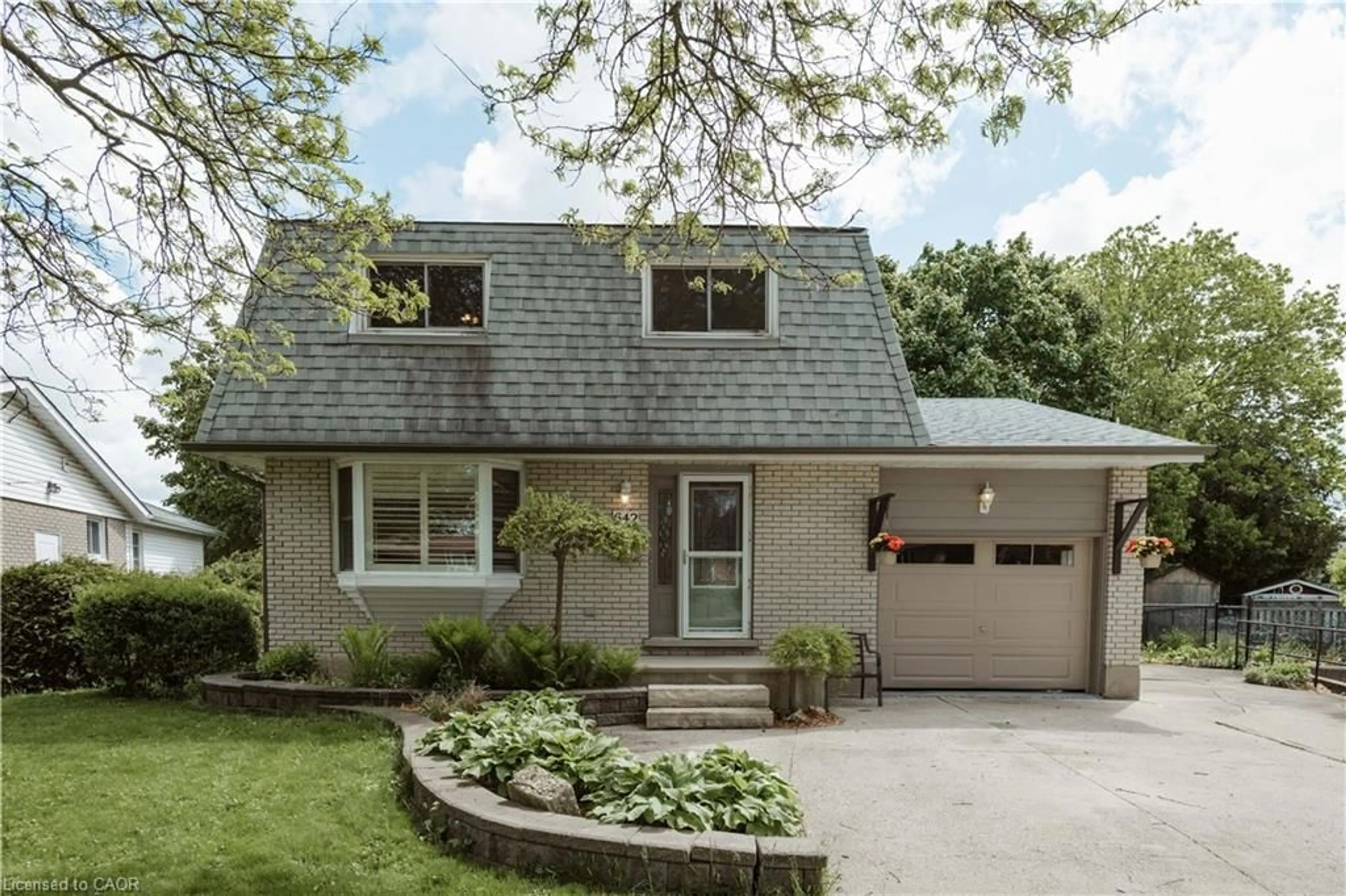 Home with brick exterior material, street for 642 Cedargrove Pl, Waterloo Ontario N2L 4Y9