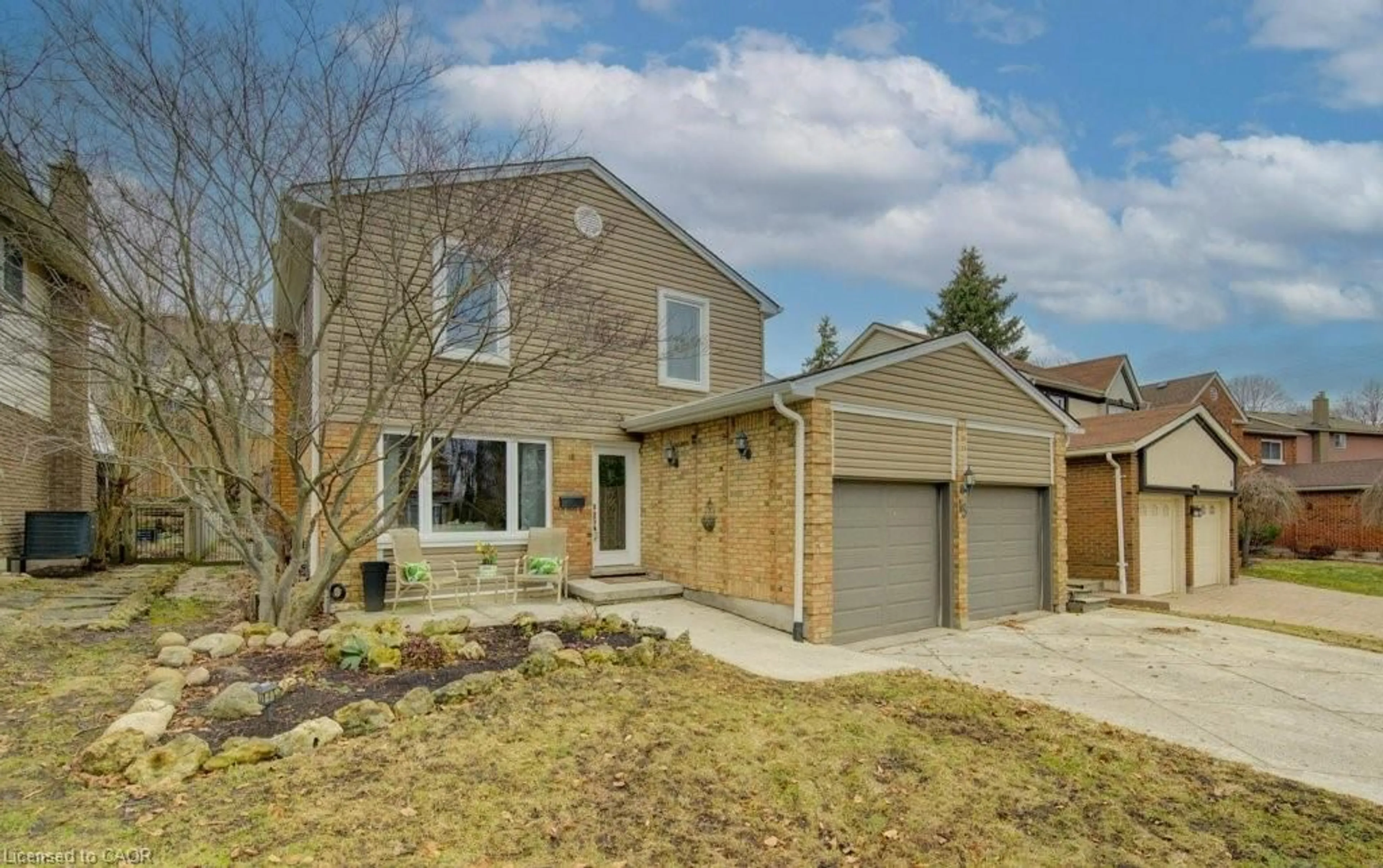 Home with brick exterior material, street for 15 Deerwood Cres, Kitchener Ontario N2N 1R4