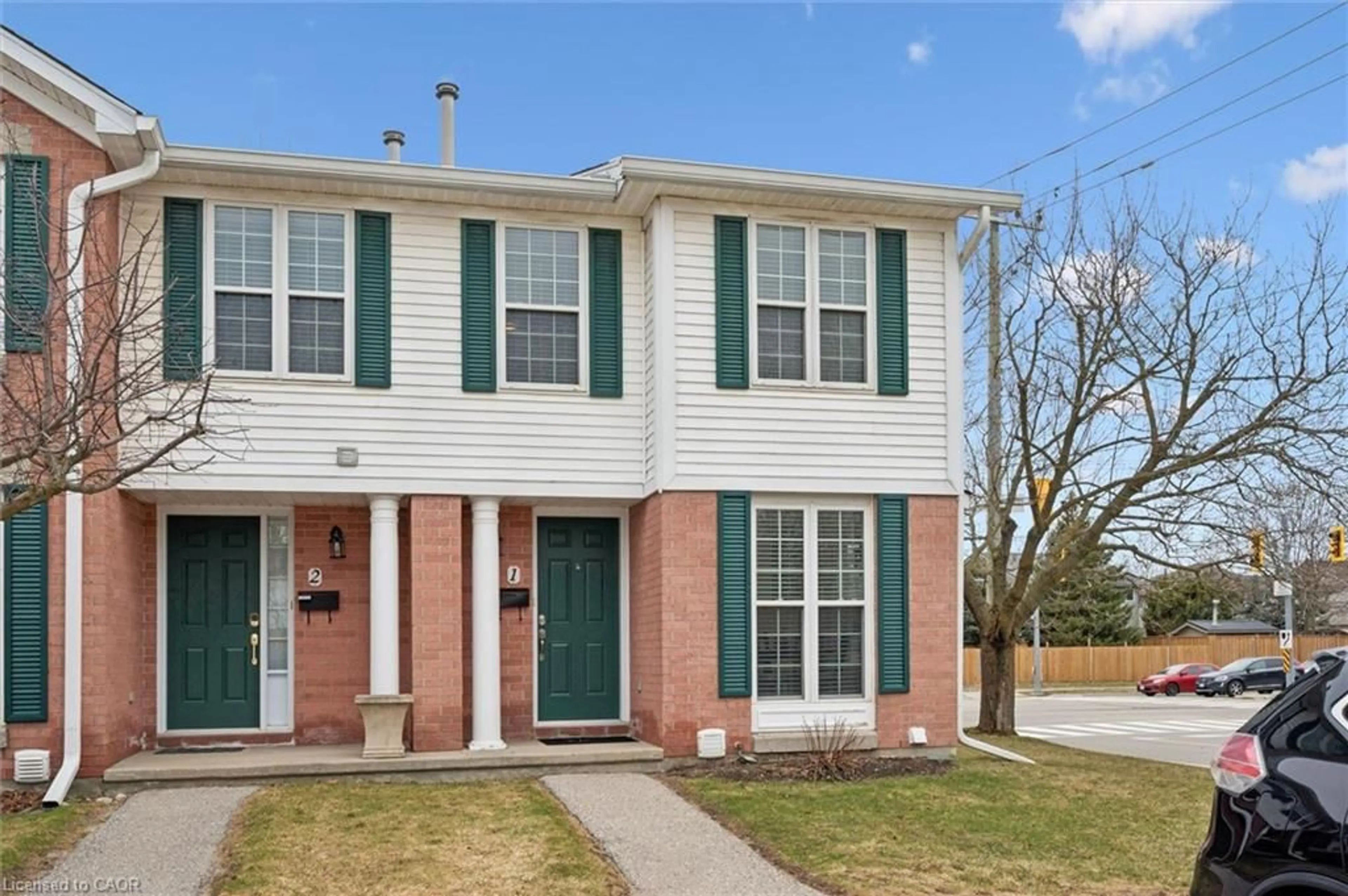 Home with brick exterior material, street for 465 Woolwich St #1, Waterloo Ontario N2K 3S4