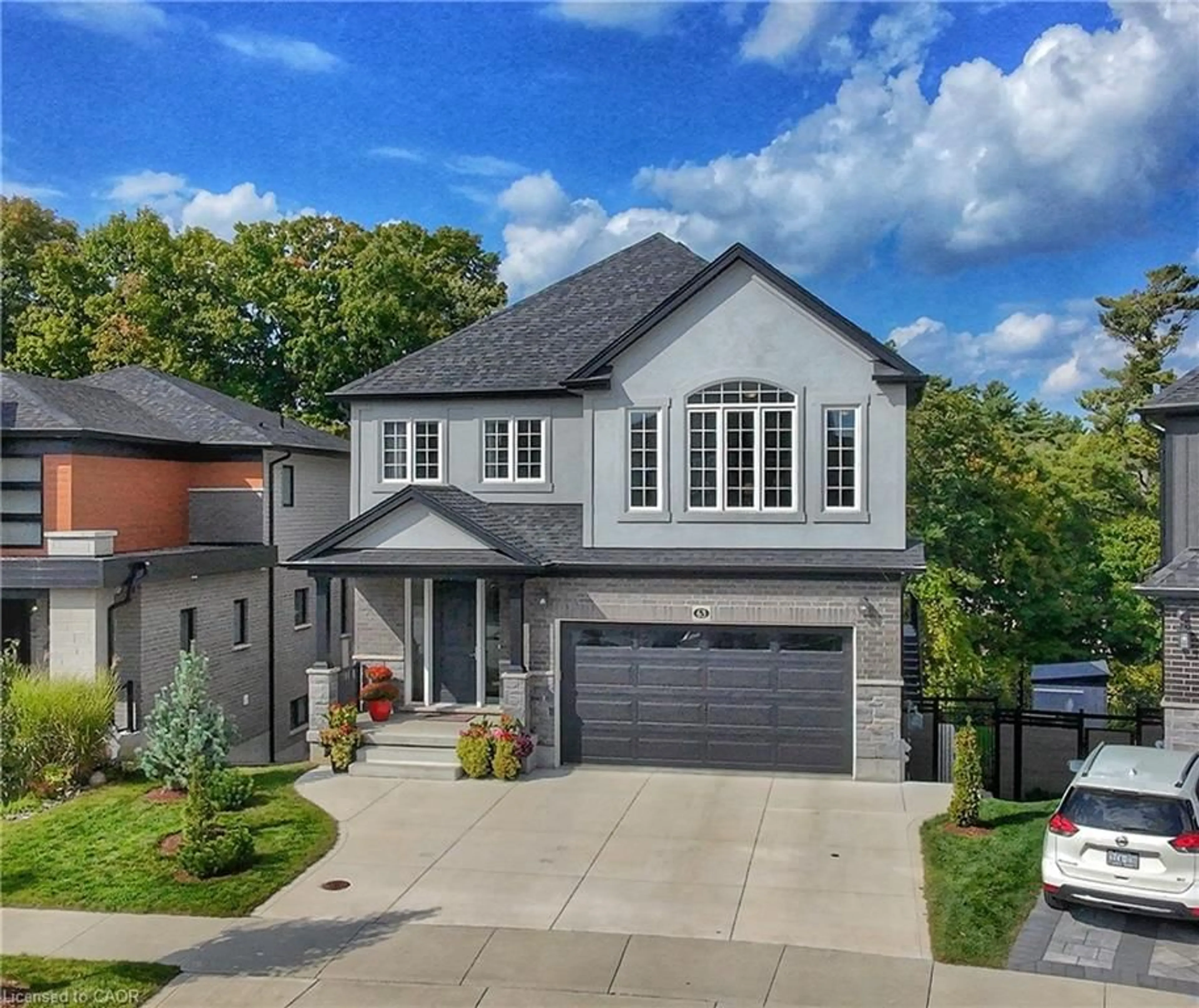 Home with brick exterior material, street for 63 Ian Ormston Dr, Kitchener Ontario N2P 2J6