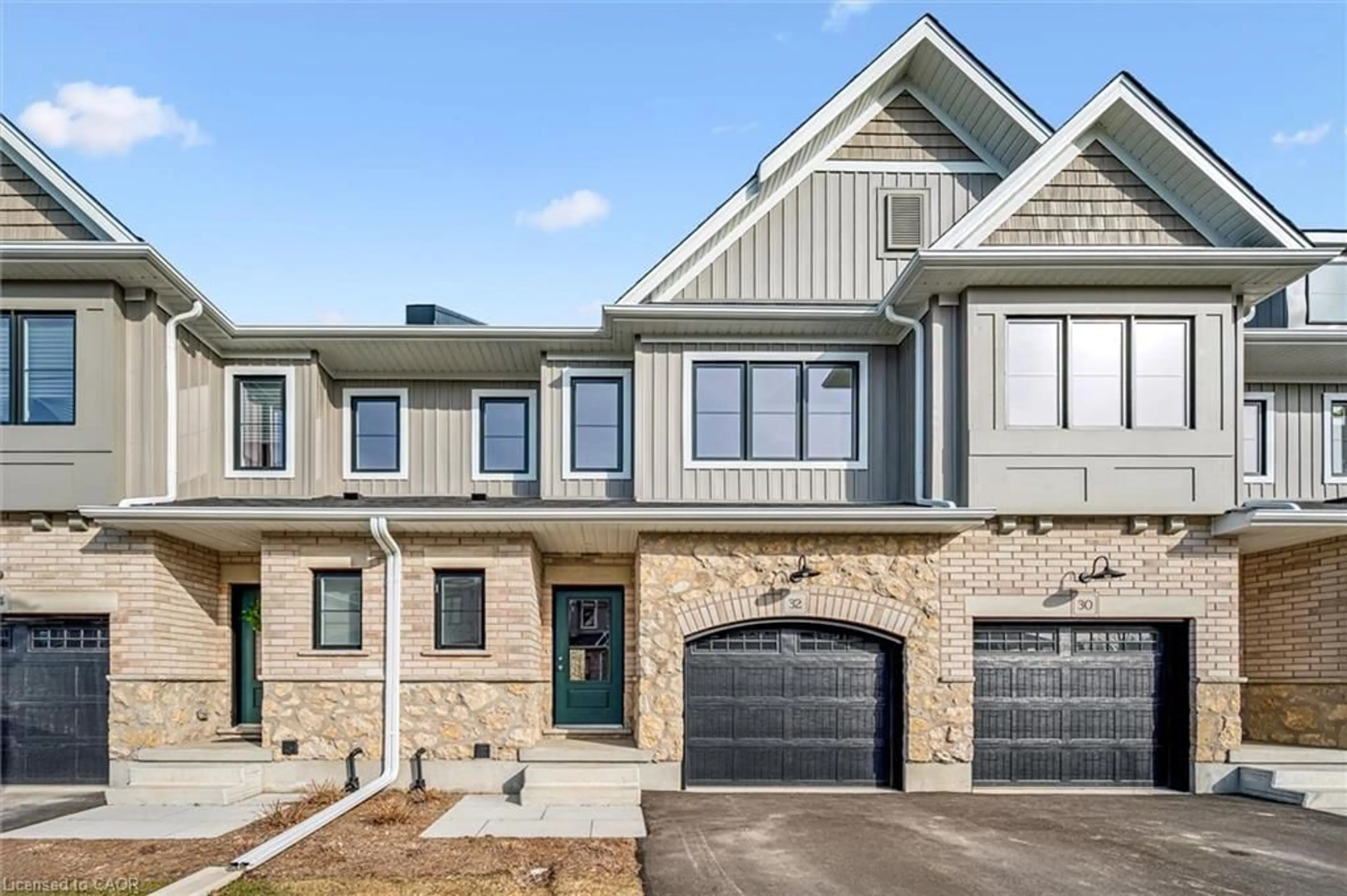 Home with brick exterior material, street for 32 Fieldstone Lane, Elora Ontario N0B 1S0