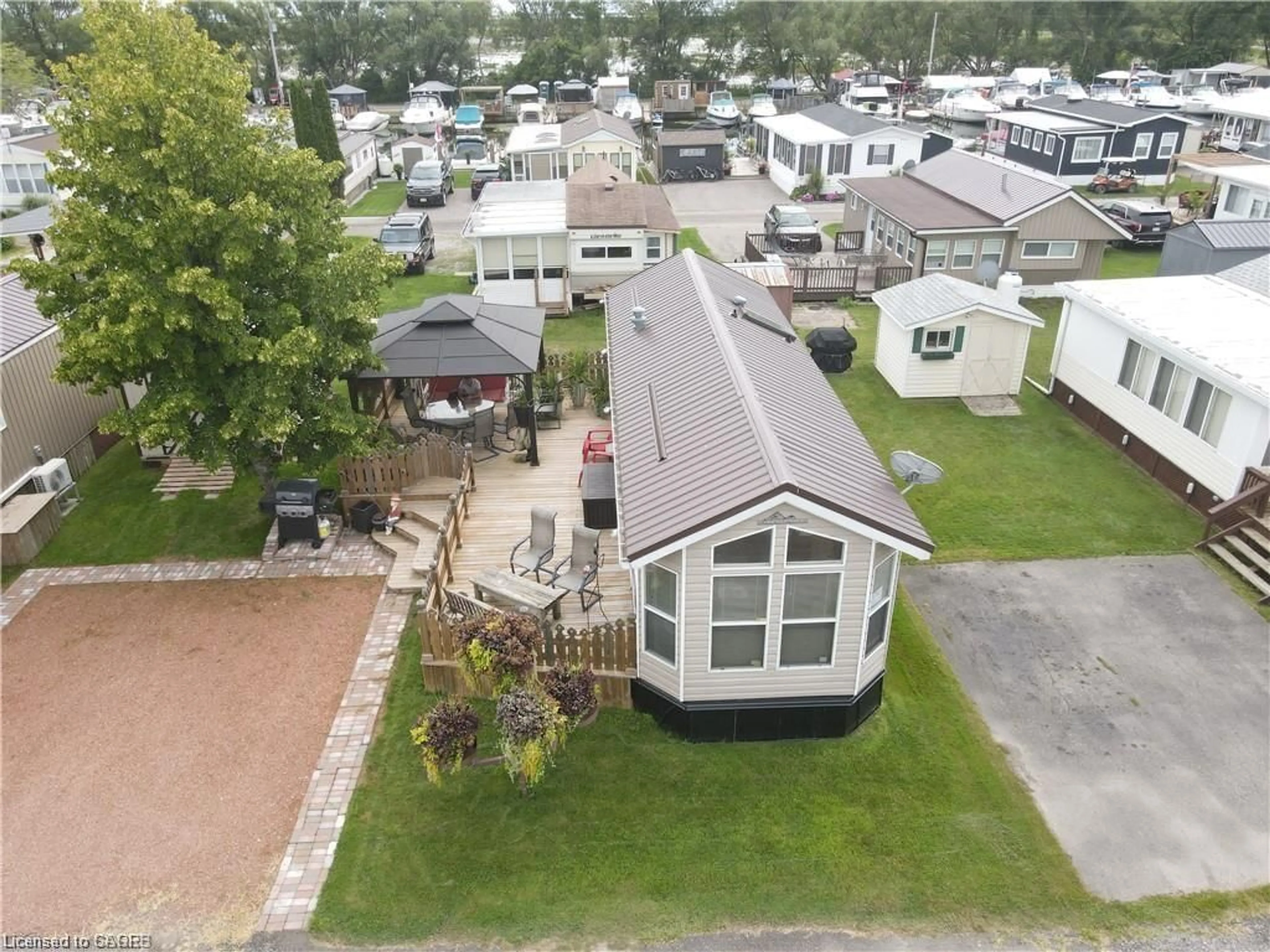 A pic from outside/outdoor area/front of a property/back of a property/a pic from drone, unknown for 92 Clubhouse Rd #47, Turkey Point Ontario N0E 1T0
