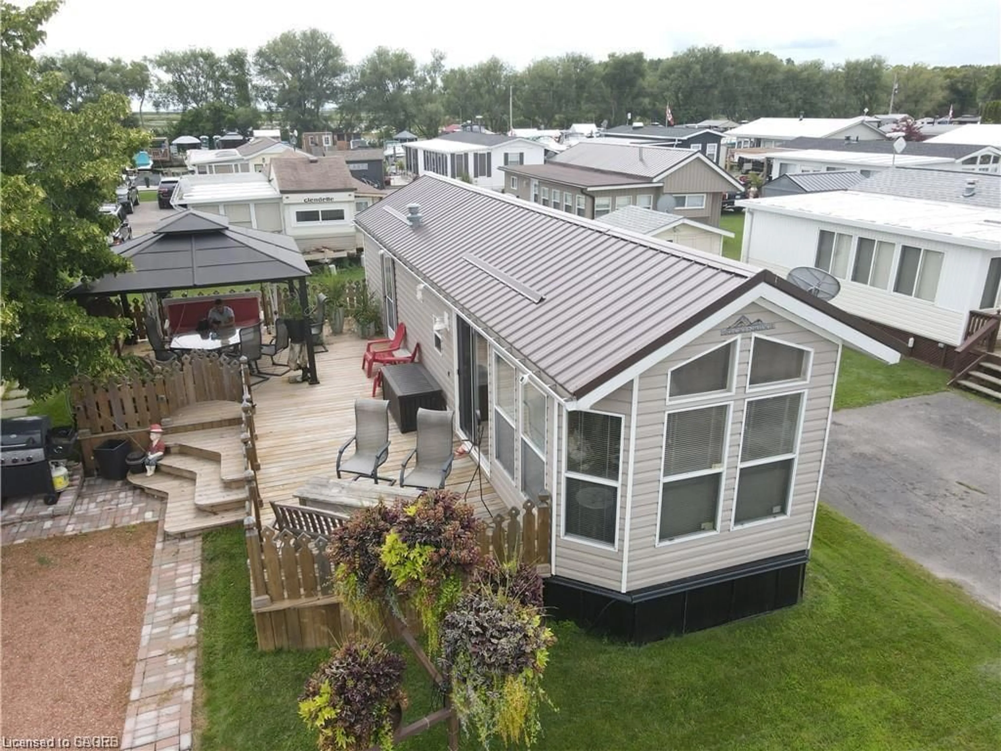 A pic from outside/outdoor area/front of a property/back of a property/a pic from drone, mountain view for 92 Clubhouse Rd #47, Turkey Point Ontario N0E 1T0