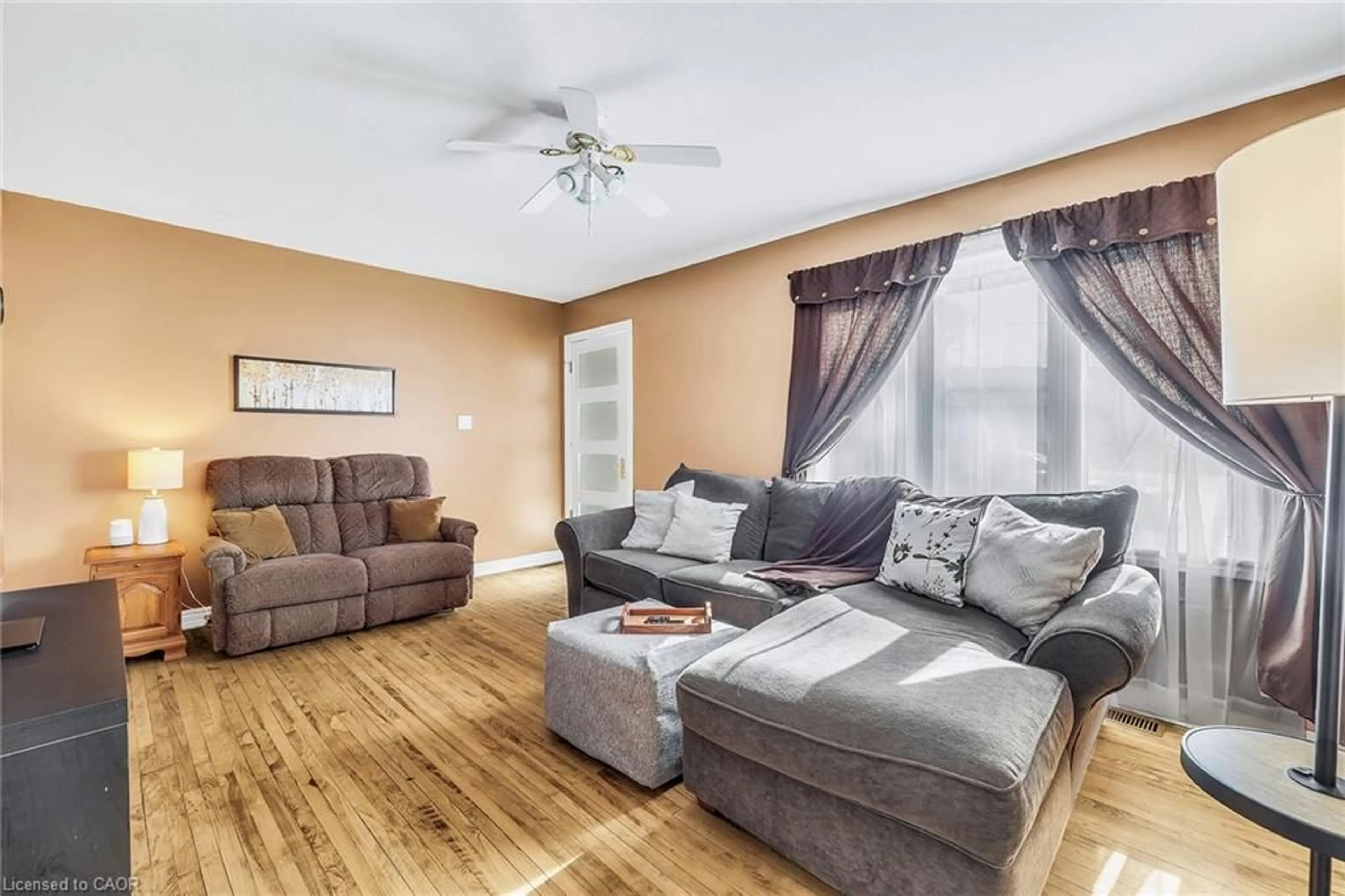 Living room with furniture, wood/laminate floor for 229 Havelock Ave, Listowel Ontario N4W 2A5