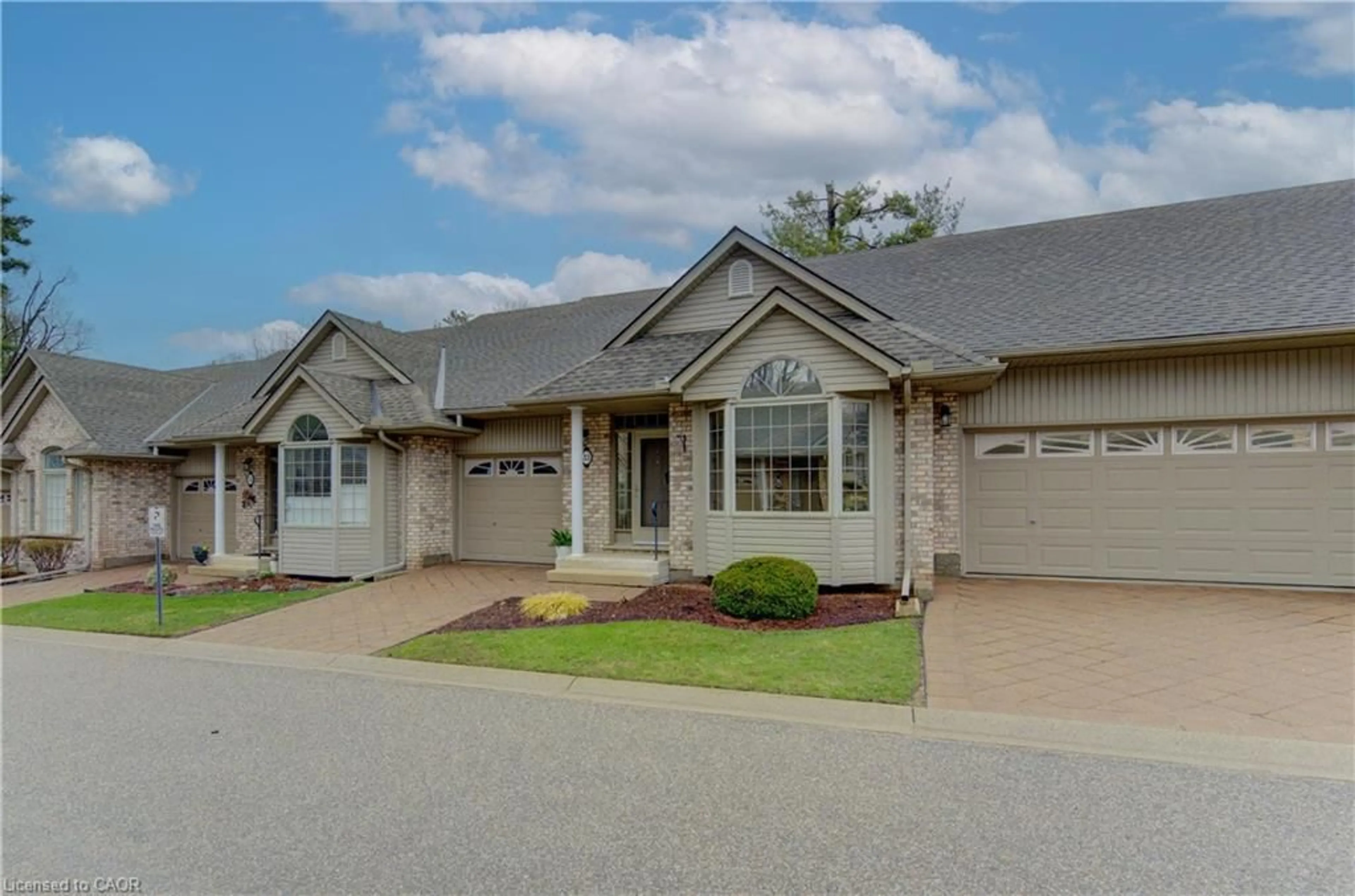 Home with brick exterior material, street for 74 Autumn Ridge Trail #33, Kitchener Ontario N2P 2M5