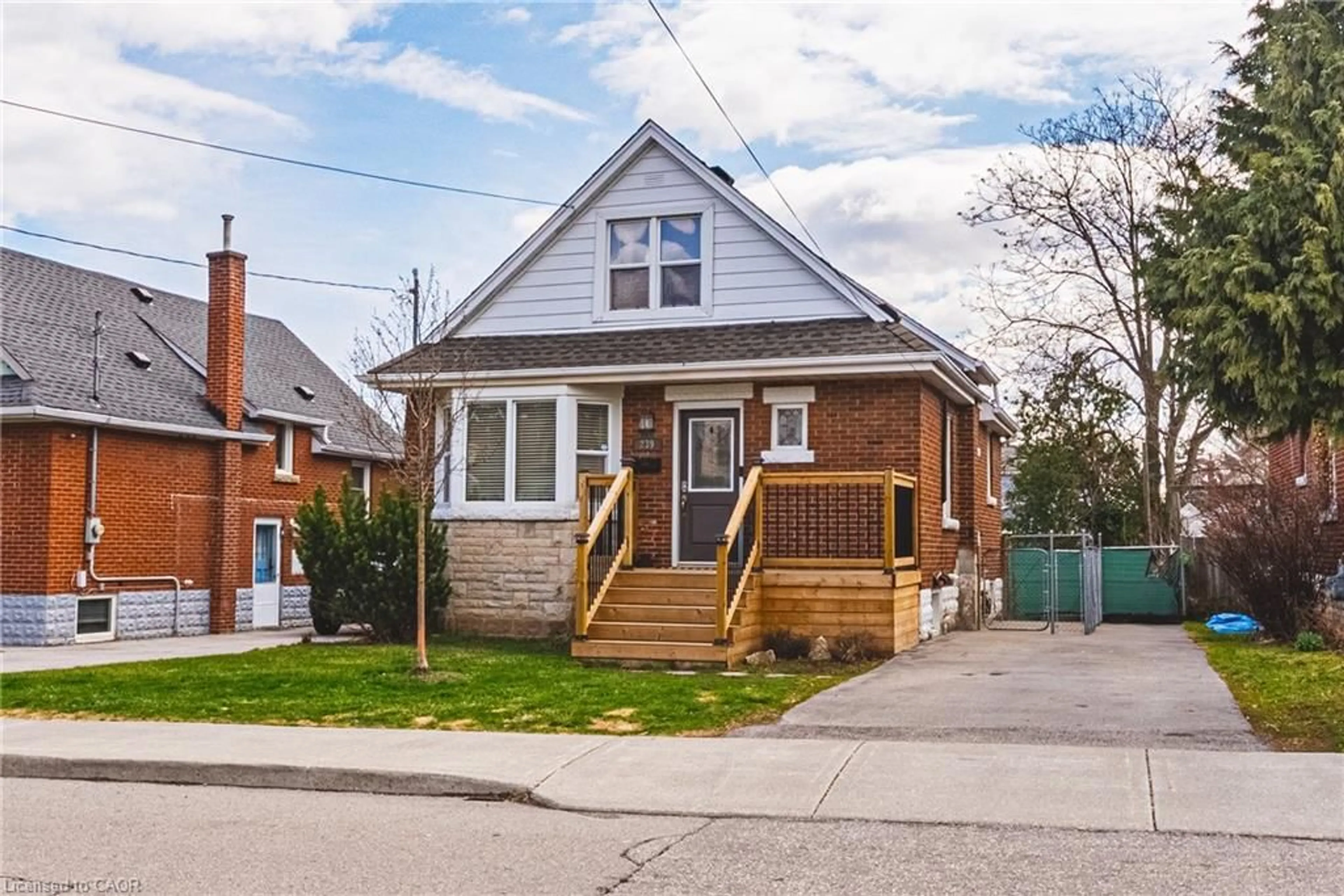 Home with brick exterior material, street for 239 Rosewood Rd, Hamilton Ontario L8K 3J5