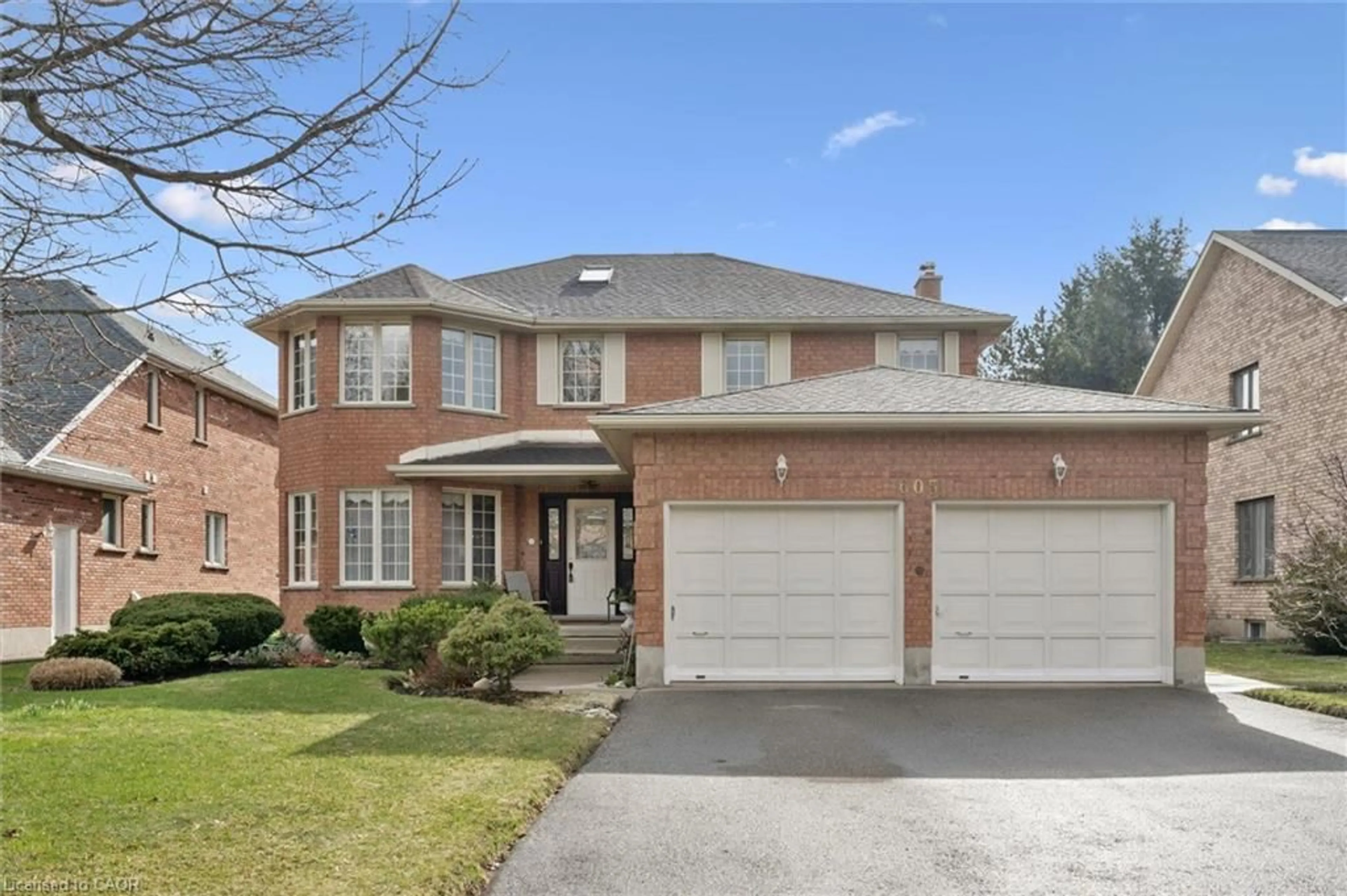 Home with brick exterior material, street for 605 Stonebury Cres, Waterloo Ontario N2K 3R2