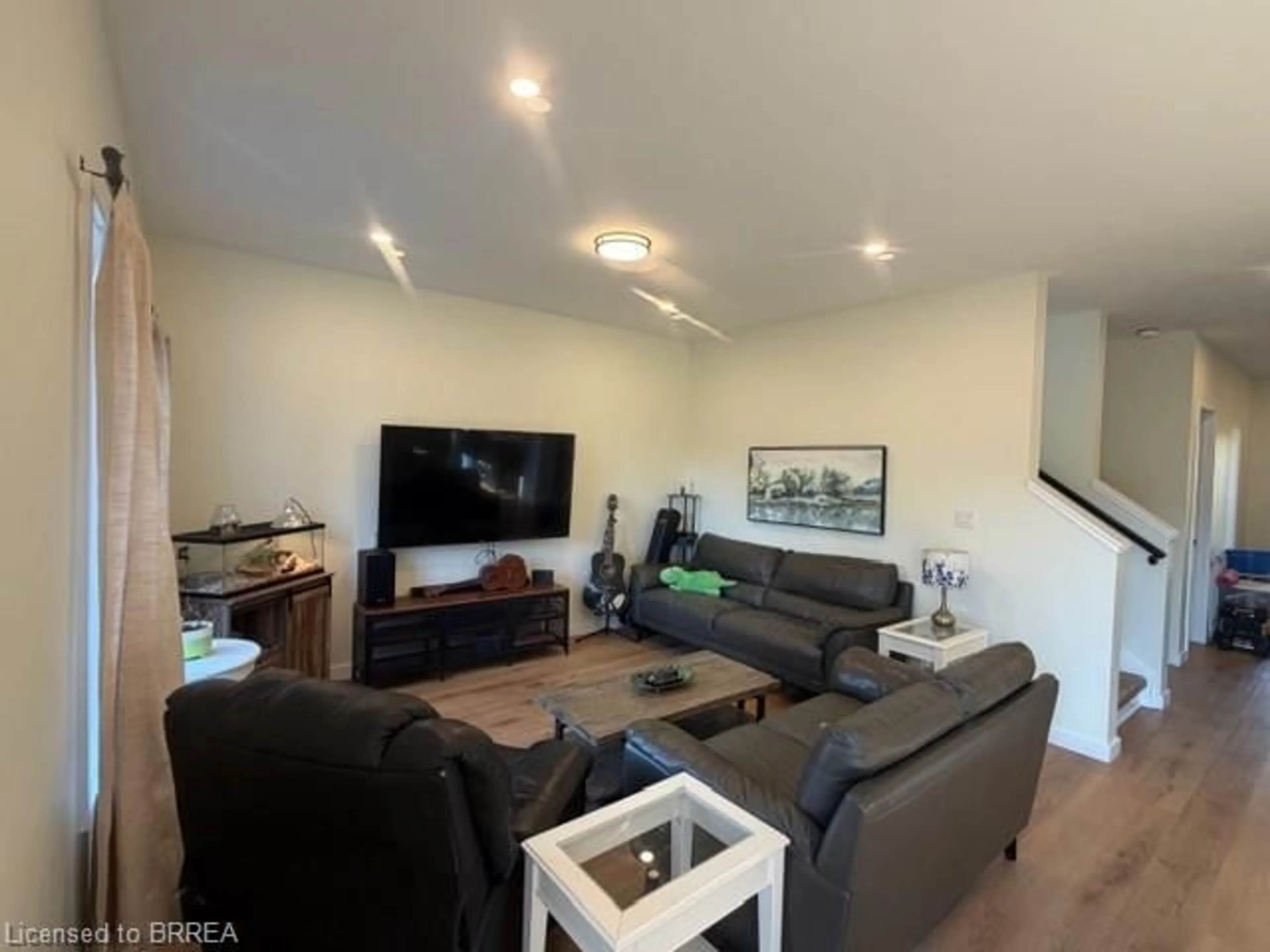 Living room with furniture, wood/laminate floor for 3985B Milton St, Shakespeare Ontario N0B 2P0