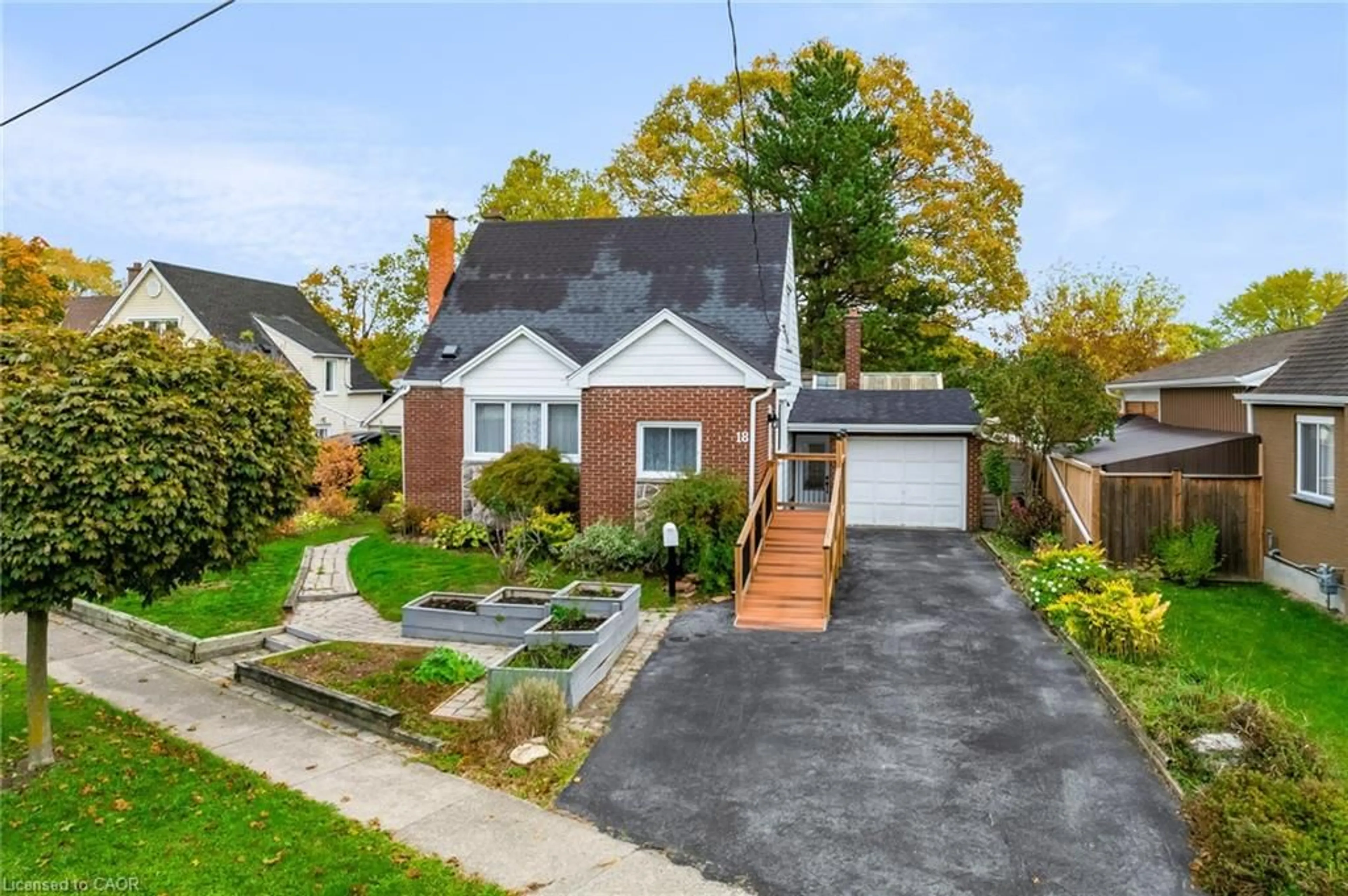 Home with brick exterior material, street for 18 Flanders Ave, St. Catharines Ontario L2M 5X3