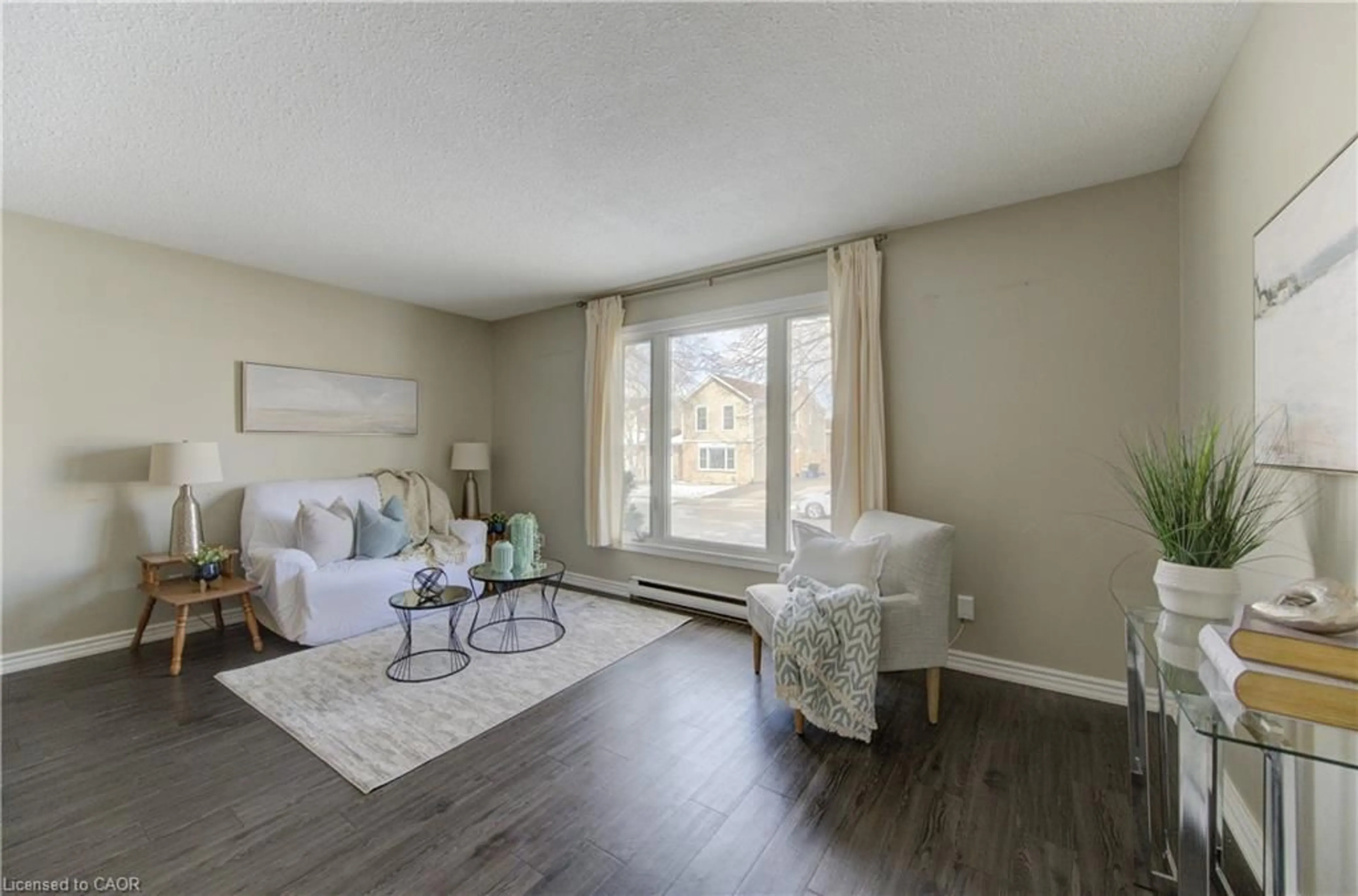Living room with furniture, wood/laminate floor for 184 Silver Aspen Cres, Kitchener Ontario N2N 1J1