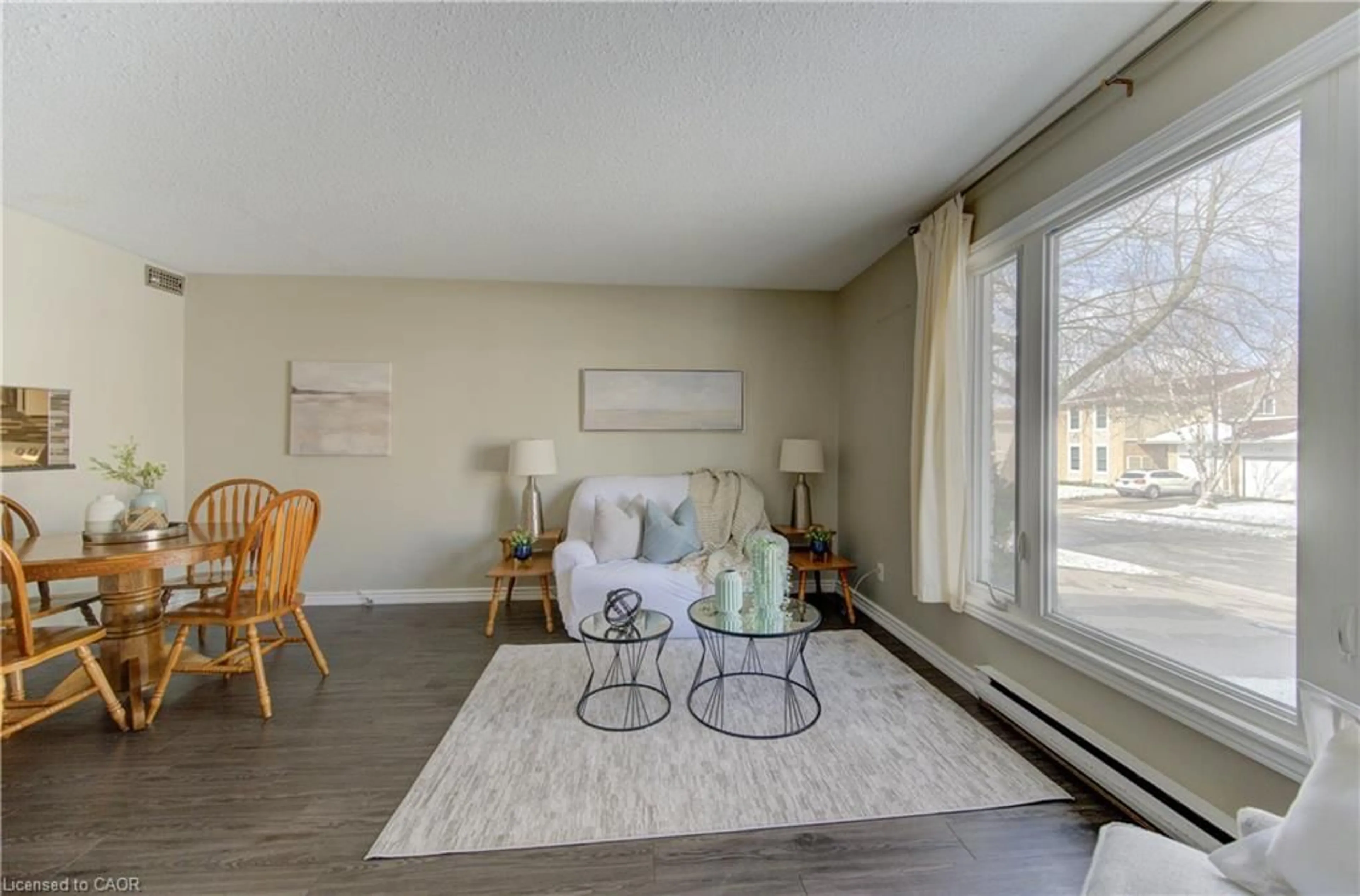 Living room with furniture, wood/laminate floor for 184 Silver Aspen Cres, Kitchener Ontario N2N 1J1
