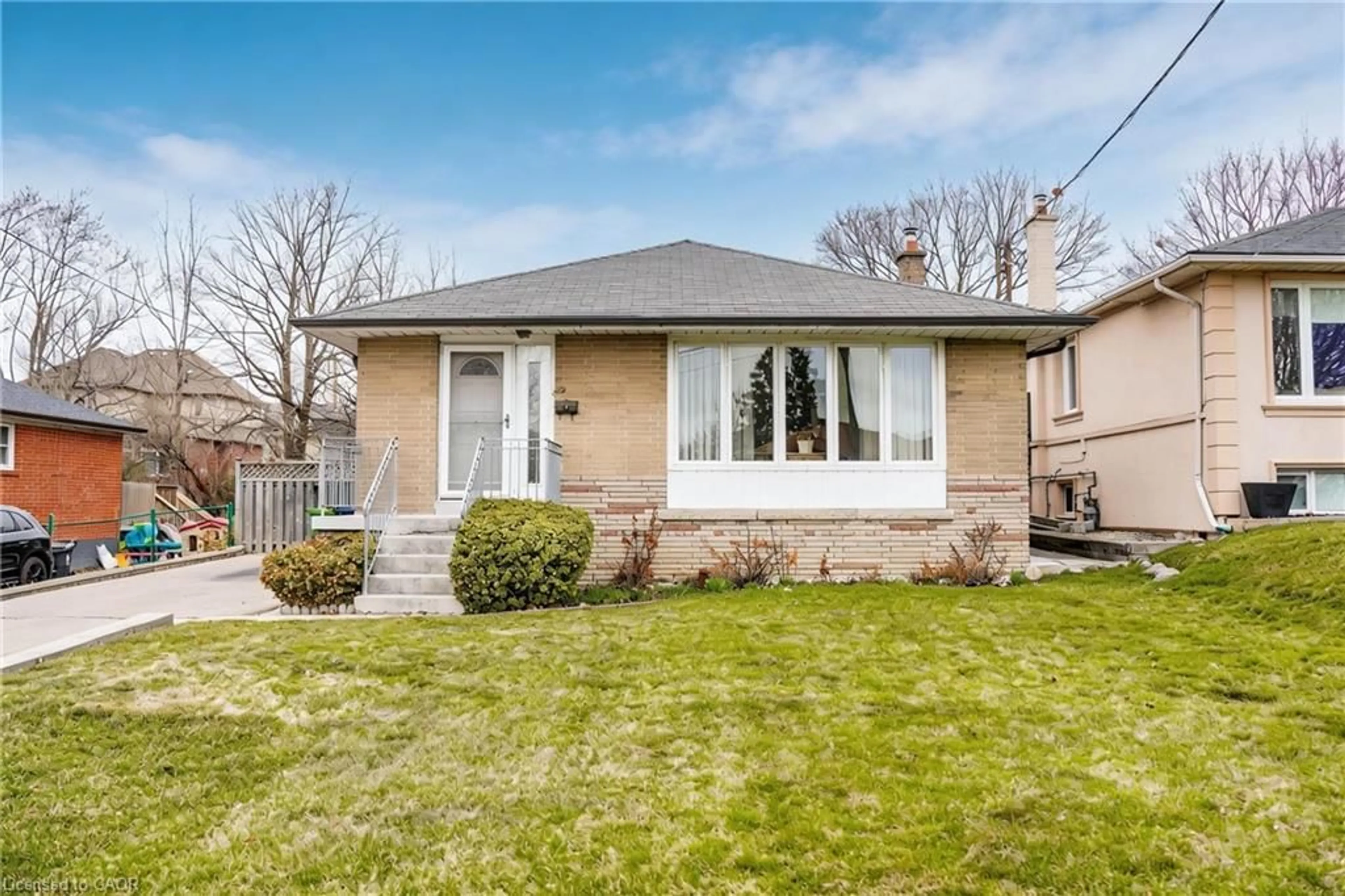 Home with brick exterior material, street for 32 Deevale Rd, North York Ontario M3M 1Z3