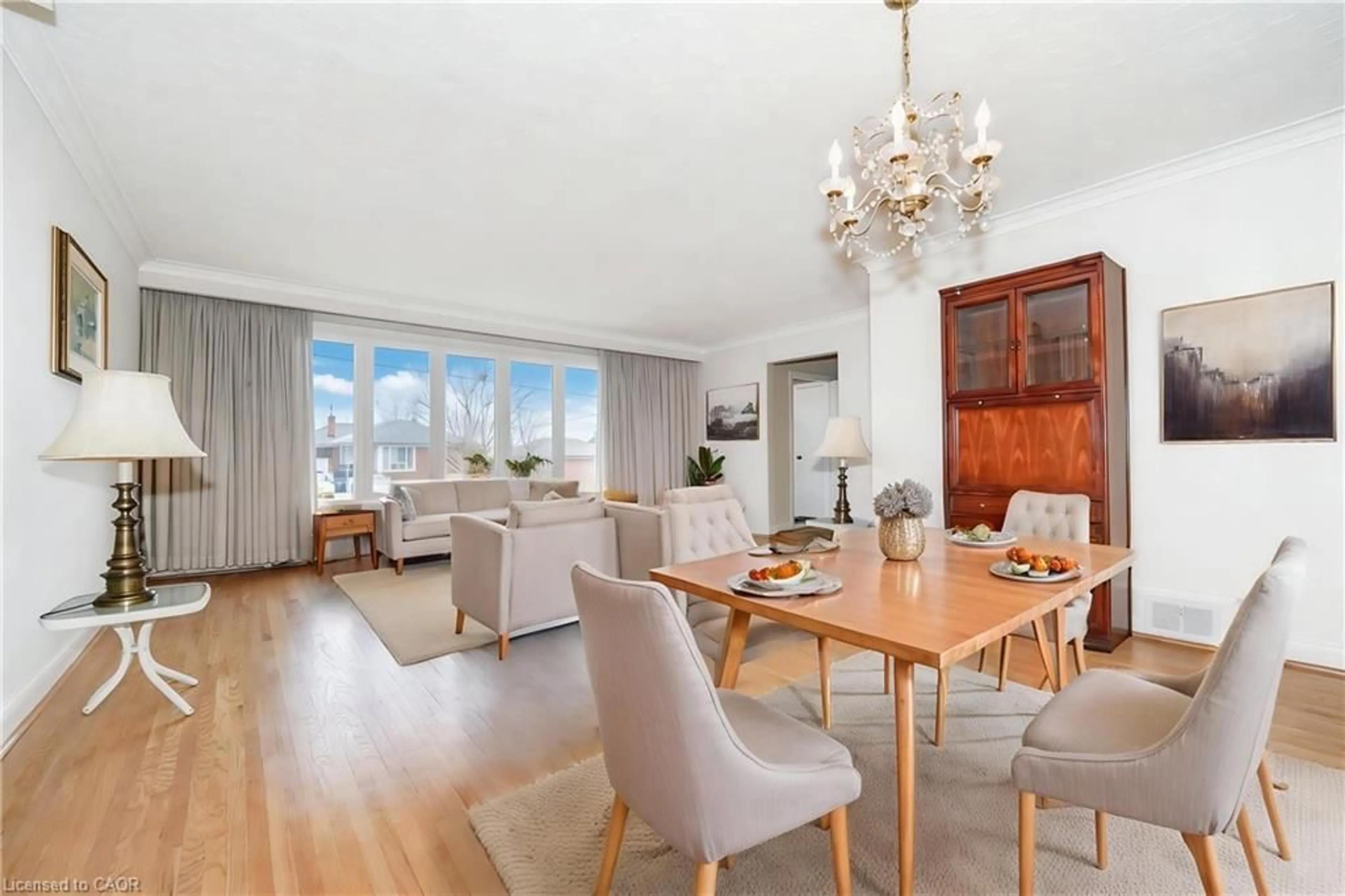 Living room with furniture, wood/laminate floor for 32 Deevale Rd, North York Ontario M3M 1Z3