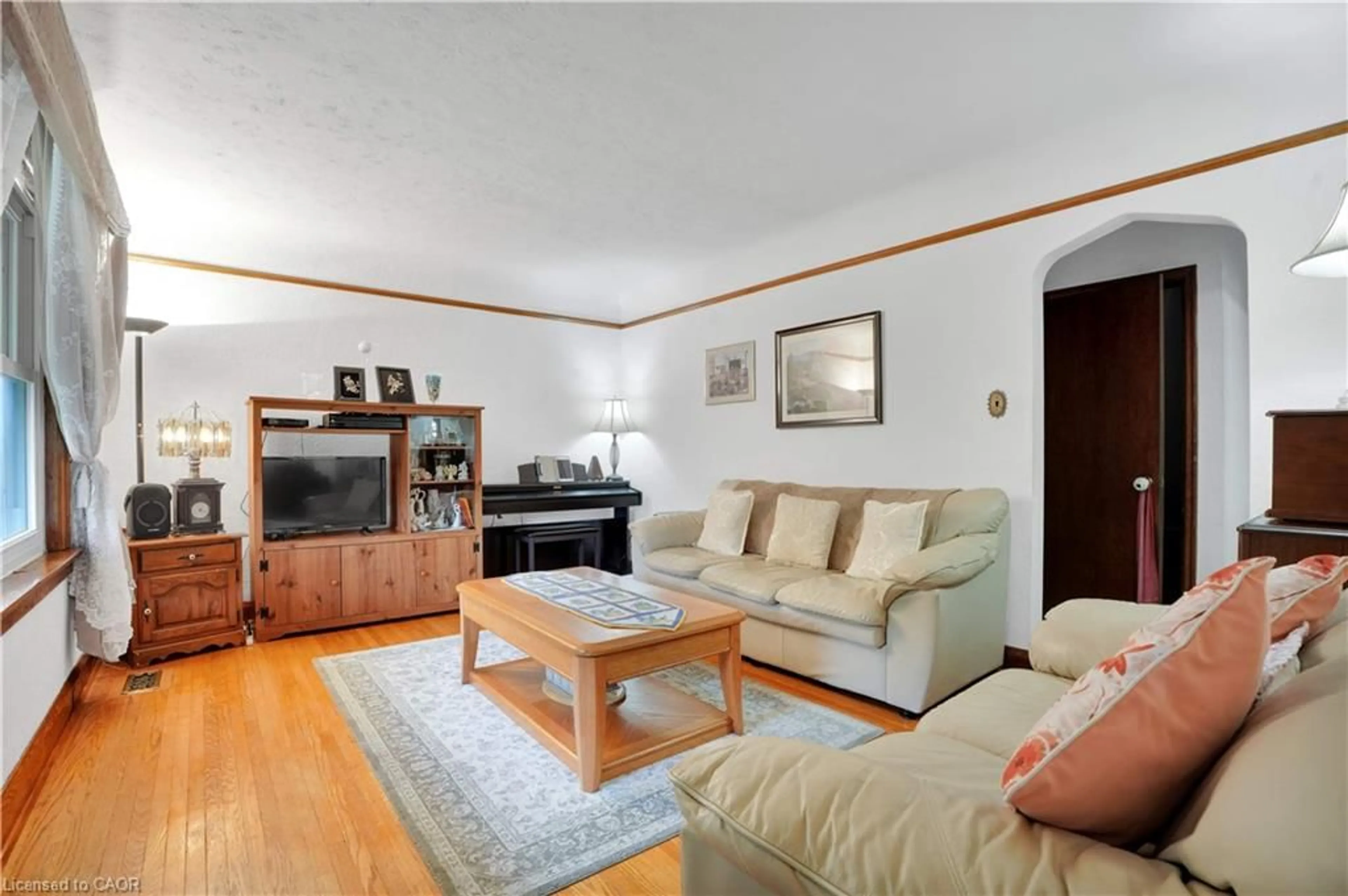 Living room with furniture, wood/laminate floor for 22 Graber Pl, Kitchener Ontario N2A 1G8