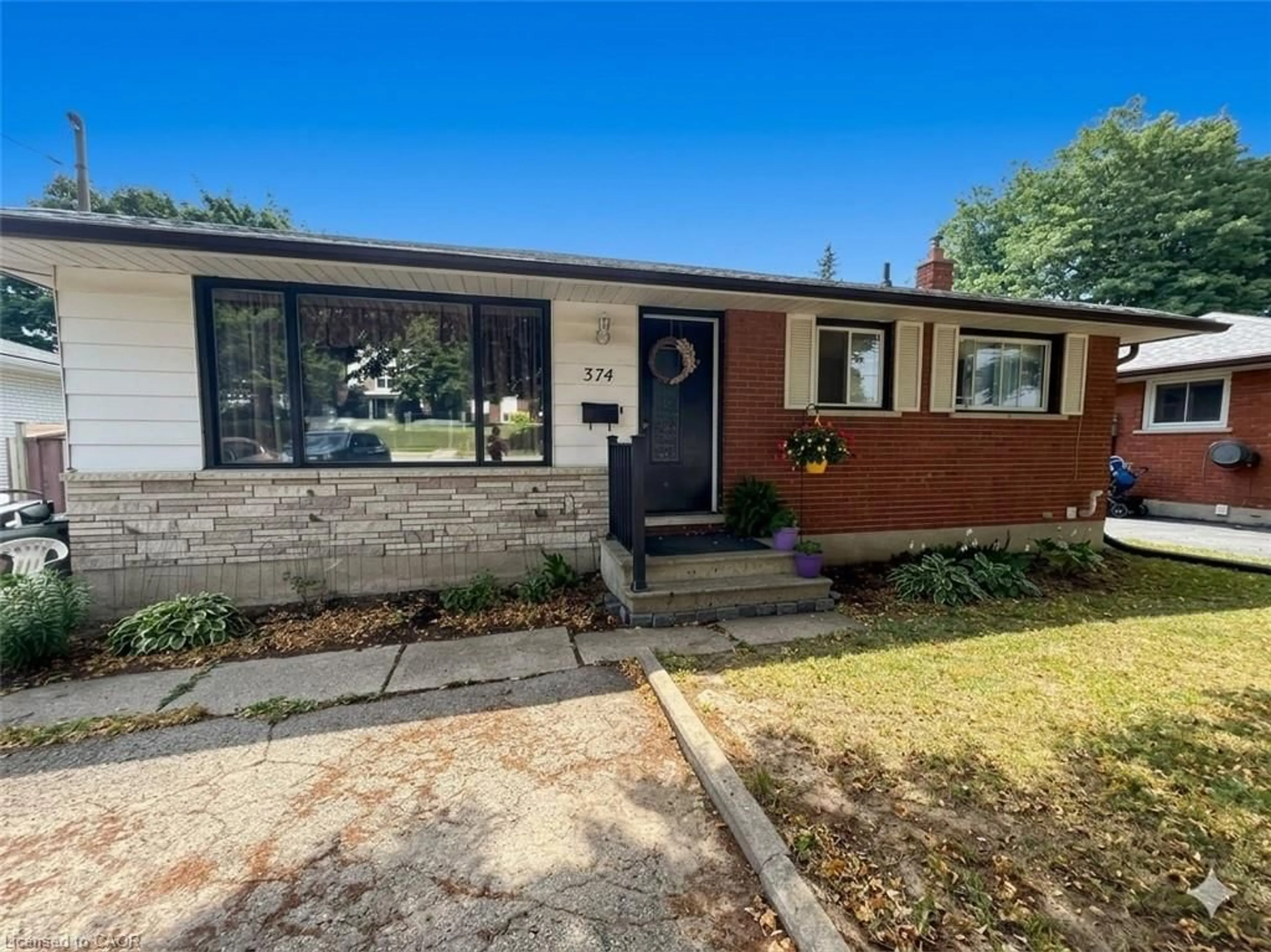 Home with brick exterior material, street for 374 Victoria Rd, Guelph Ontario N1E 5J7