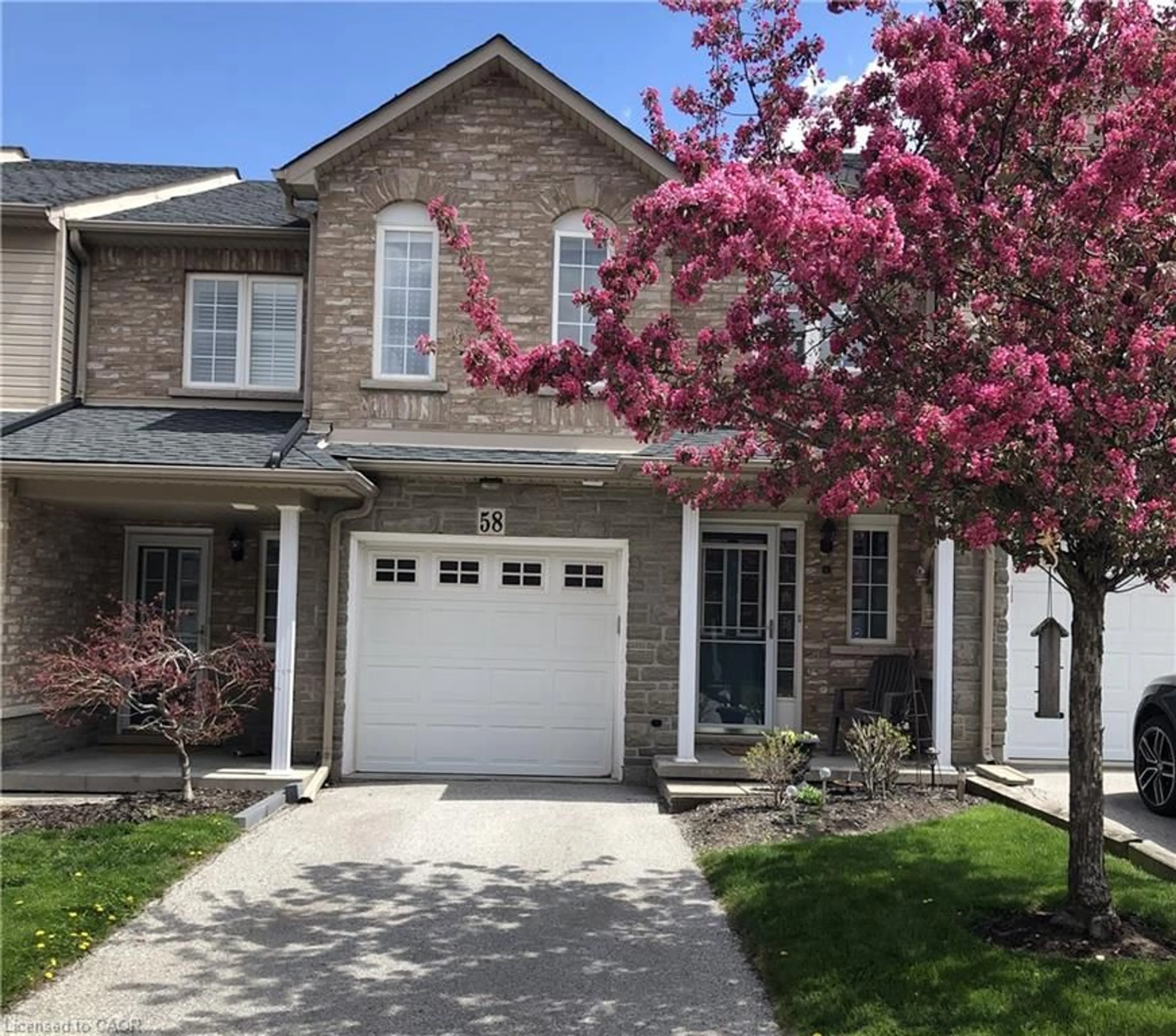 Home with brick exterior material, street for 7 Southside Pl #58, Hamilton Ontario L9C 7W6