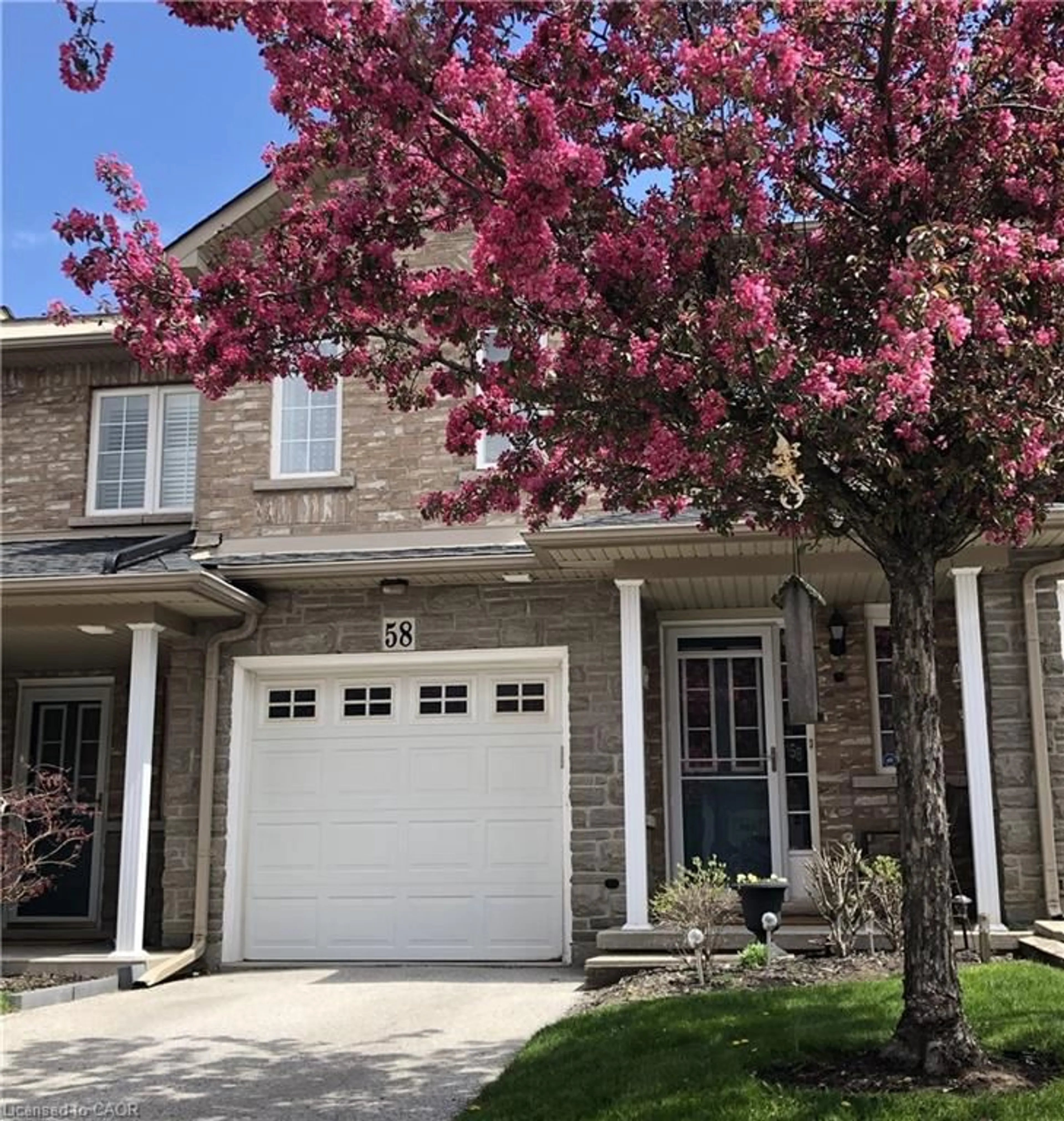 Home with brick exterior material, street for 7 Southside Pl #58, Hamilton Ontario L9C 7W6