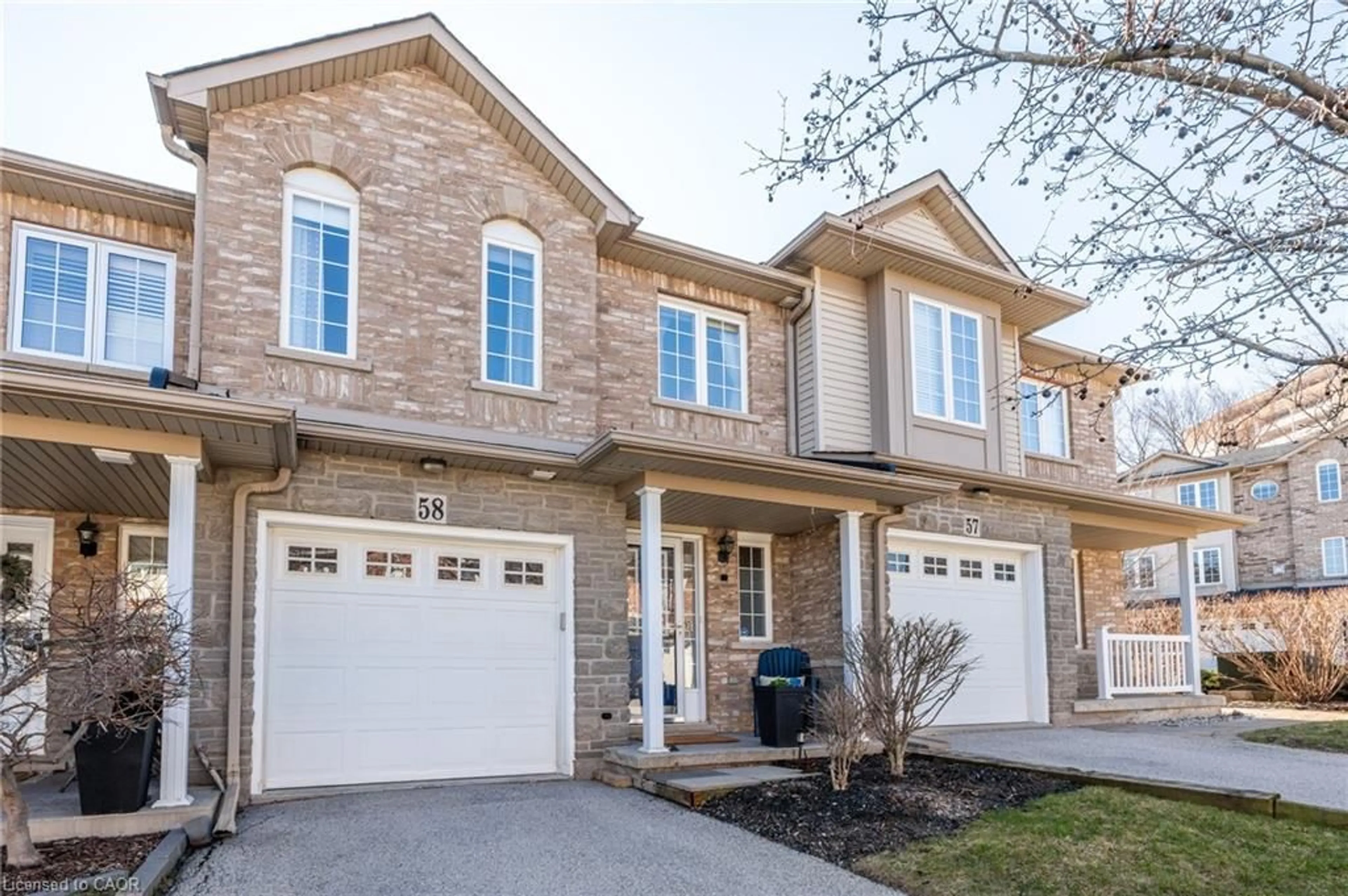 Home with brick exterior material, street for 7 Southside Pl #58, Hamilton Ontario L9C 7W6