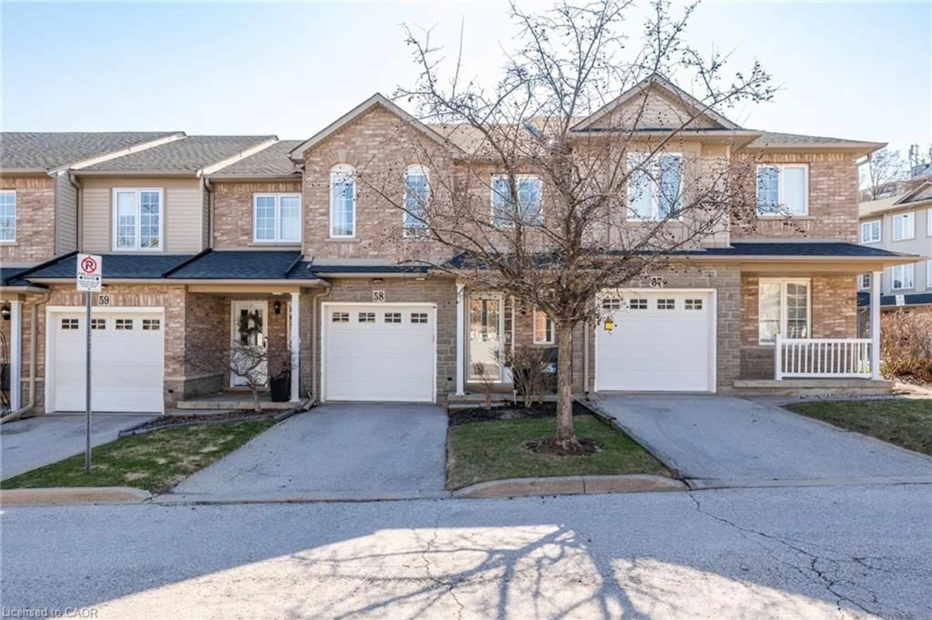 Home with brick exterior material, street for 7 Southside Pl #58, Hamilton Ontario L9C 7W6