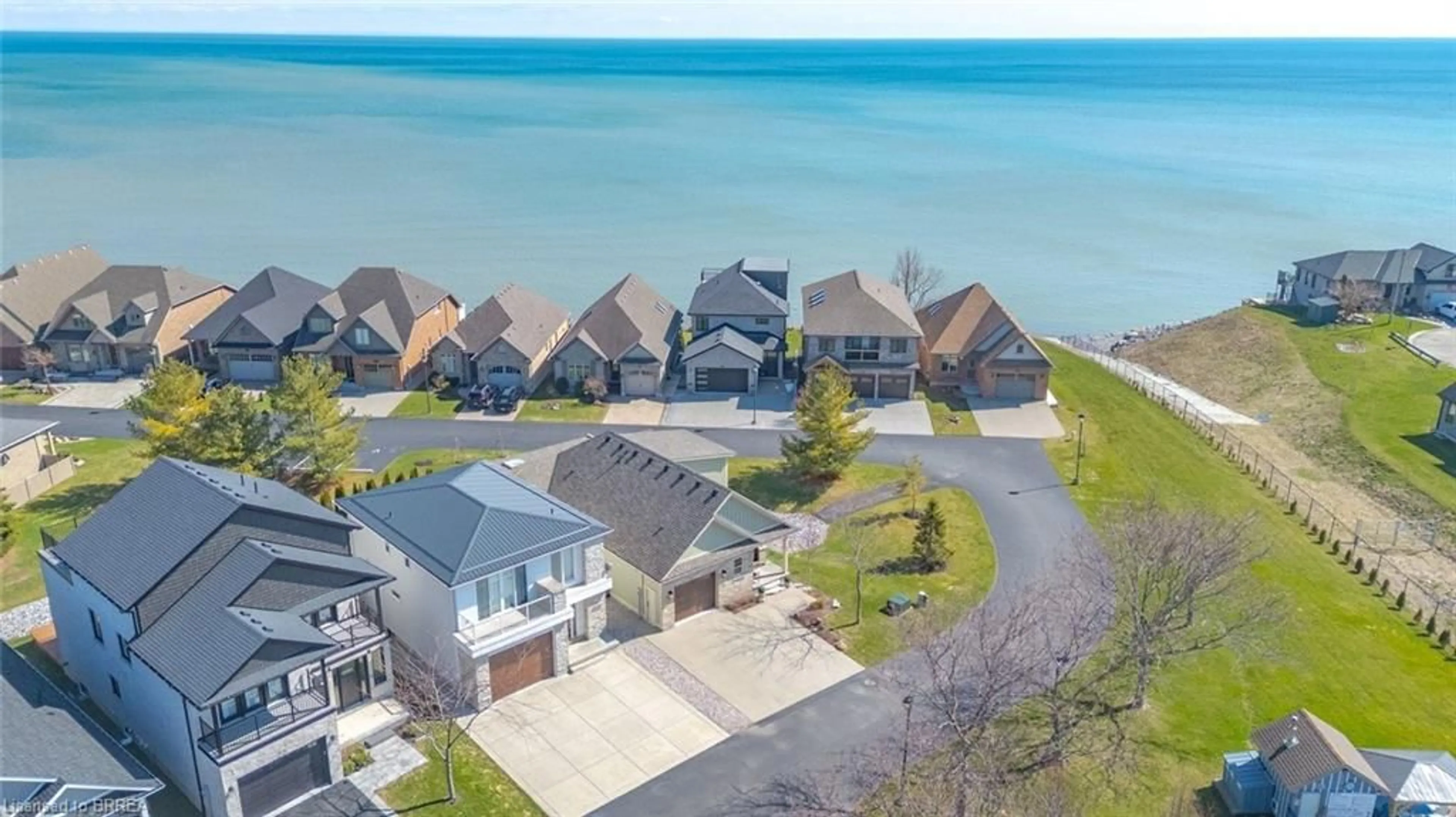 A pic from outside/outdoor area/front of a property/back of a property/a pic from drone, water/lake/river/ocean view for 80 New Lakeshore Rd #20, Port Dover Ontario N0A 1N8