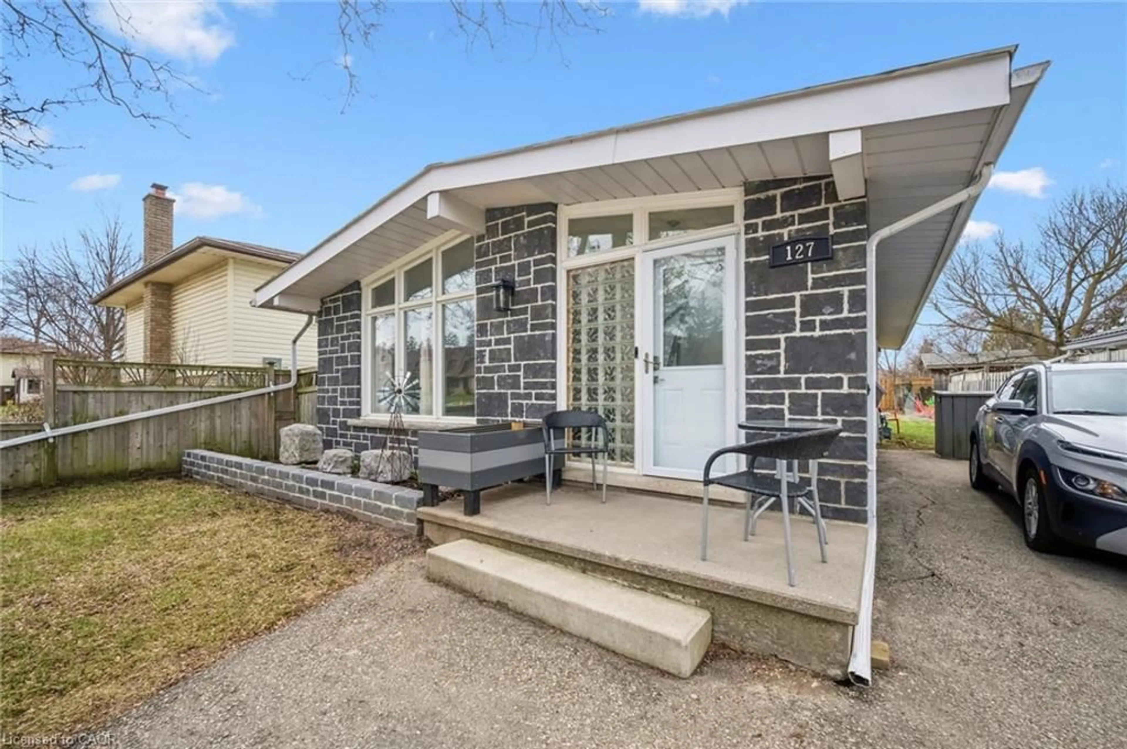 Home with brick exterior material, street for 127 Kingswood Dr, Kitchener Ontario N2E 1B2