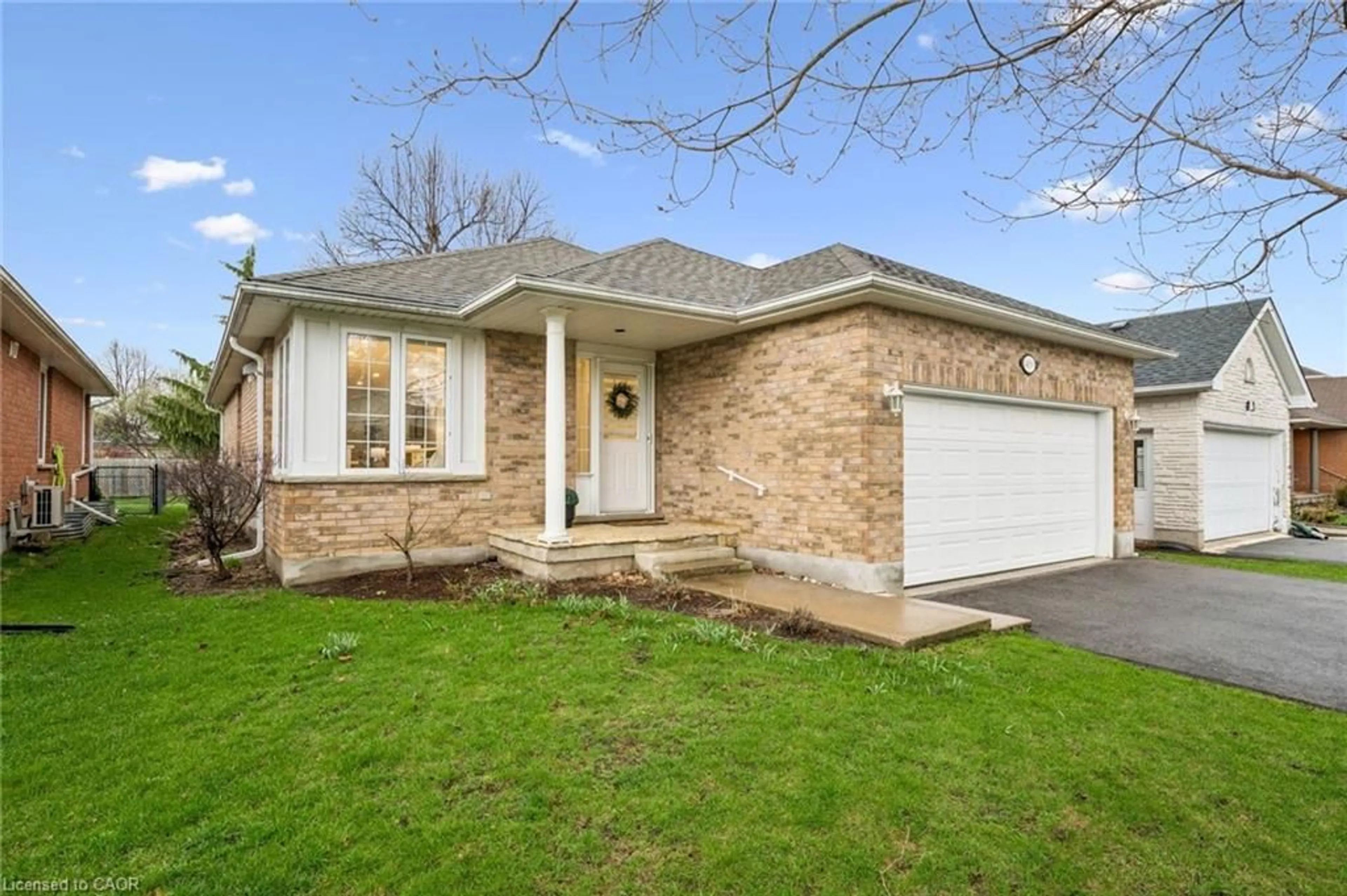 Home with brick exterior material, street for 489 Brentcliffe Dr, Waterloo Ontario N2T 2R8
