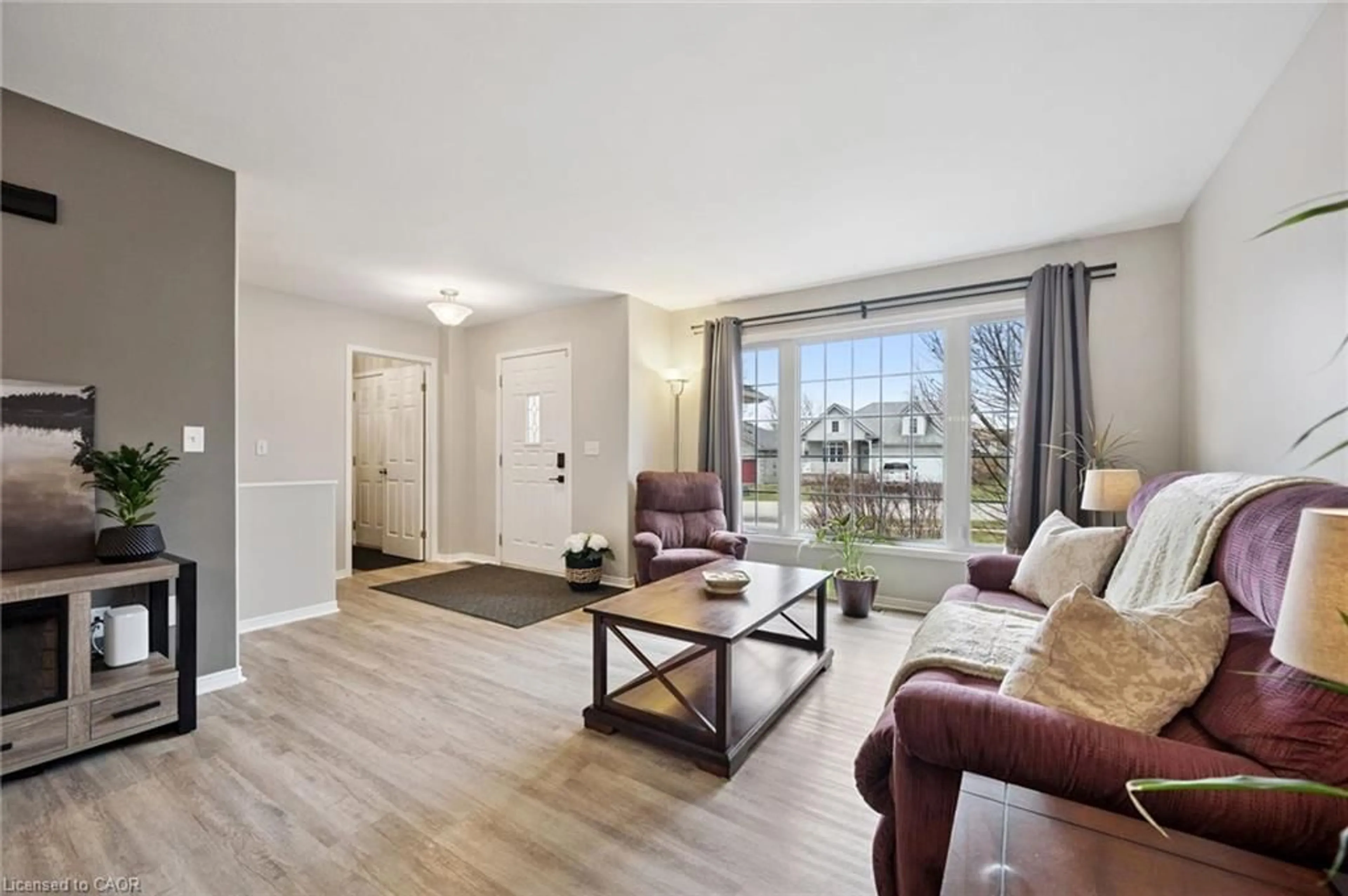 Living room with furniture, wood/laminate floor for 119 Meadowridge Dr, St. Marys Ontario N4X 1A6